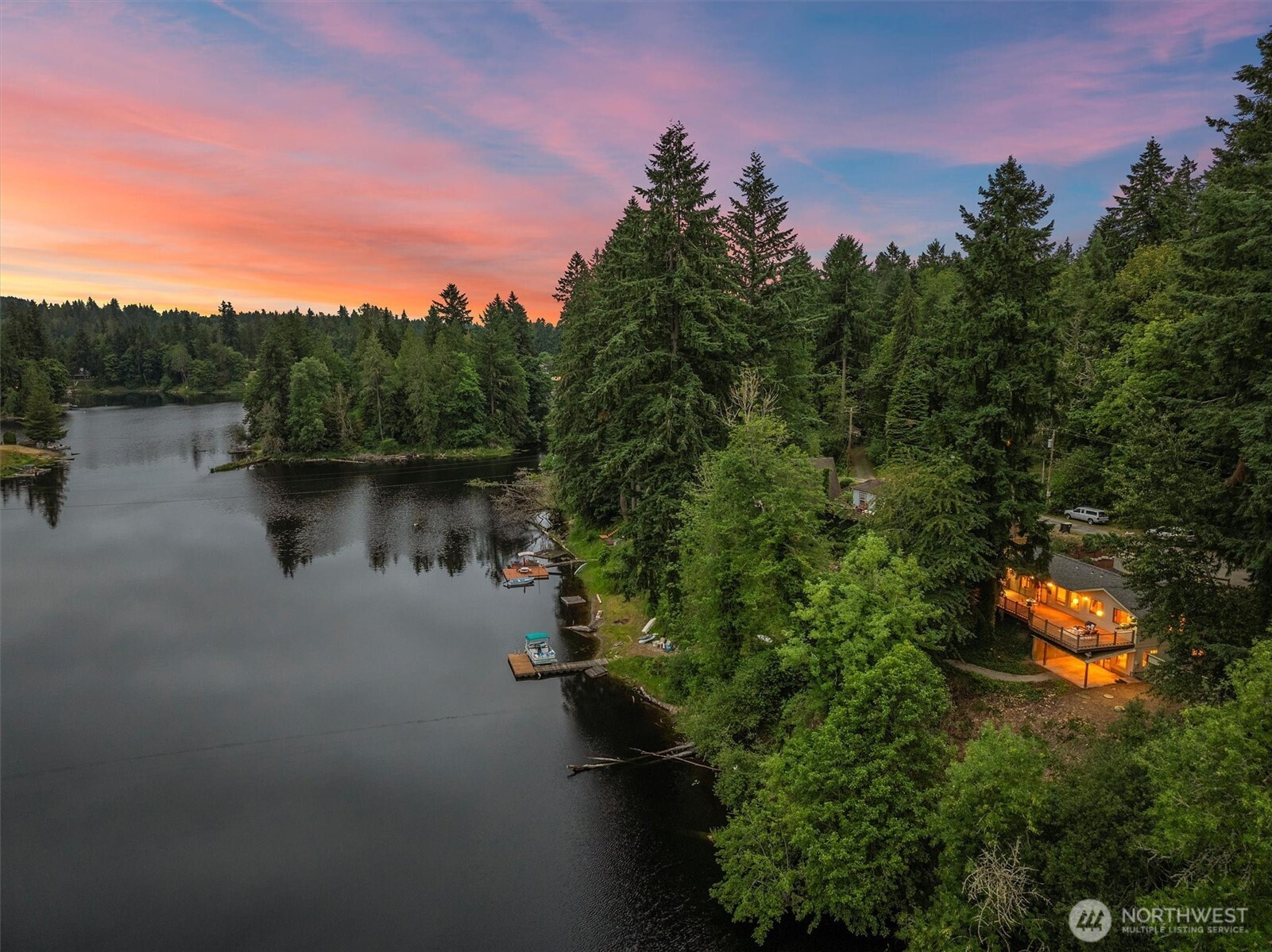 Discover a rare opportunity on the highly coveted Lake St. Clair in Olympia! This charming 3-bedroom, 1.5-bath home on nearly an acre boasts approximately 150 feet of lake frontage and sweeping water views that invite peace and relaxation. Inside, the open-concept living space is bathed in natural light, offering seamless flow to the expansive deck—ideal for quiet mornings with coffee or lively summer gatherings. Stay cool all season long with a heat pump and A/C. The large driveway provides plenty of space to park your RV or boat.  Whether you're searching for a serene forever home or a weekend escape, this lakefront gem offers the perfect blend of comfort, privacy, and beauty.  Home has been de-staged.