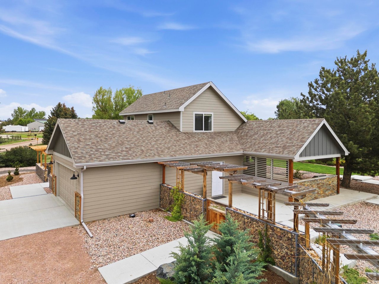 Welcome to your fully renovated oasis at 7702 Fox Chase Lane in Wellington, CO! This stunning 3-bedroom, 2.5-bathroom home offers 2,070 sq ft of living space situated on a massive1.54-acre corner lot. Basement features flex room or 4th non-conforming bedroom. With nearly $295K in recent interior and exterior upgrades, this property perfectly blends modern comfort with exceptional outdoor living. Inside, enjoy a thoughtfully updated layout featuring a main-floor primary suite and a fully remodeled kitchen with new appliances, cabinetry, and a water filtration system. Recent interior renovations include a newly finished basement bedroom, fully updated bathrooms, and a beautiful 92 sq ft expanded front entryway with a mudroom, double doors, and a front courtyard. Even the oversized 2-car garage was extended by 6 feet to comfortably fit a full-size truck! Step outside to an entertainer's dream. The fully fenced property boasts an incredible covered outdoor kitchen built in 2026, complete with a built-in gas grill, stovetop, and generous storage. Relax by the tiered patio's fire table or admire the extensive landscaping, which includes a distinct Gabion pergola, xeric and native gardens, raised vegetable beds, and a fruit orchard. It's all easily maintained by an extensive multi-zone smart irrigation system. The outbuildings truly set this property apart. Car enthusiasts and hobbyists will be blown away by the massive 2,240 sq ft (40x56) shop, featuring 6-inch reinforced concrete floors, full insulation, and dual gas-fired heaters. Green thumbs will fall in love with the climate-controlled greenhouse, equipped with a unique underground "climate battery" system to naturally regulate temperatures year-round. There's also a charming silo shed for extra equipment storage and two dedicated RV parking spaces. Complete with a newer roof, updated siding, and a convenient circle driveway, this rare property truly has it all! 1-year Home Warranty also included