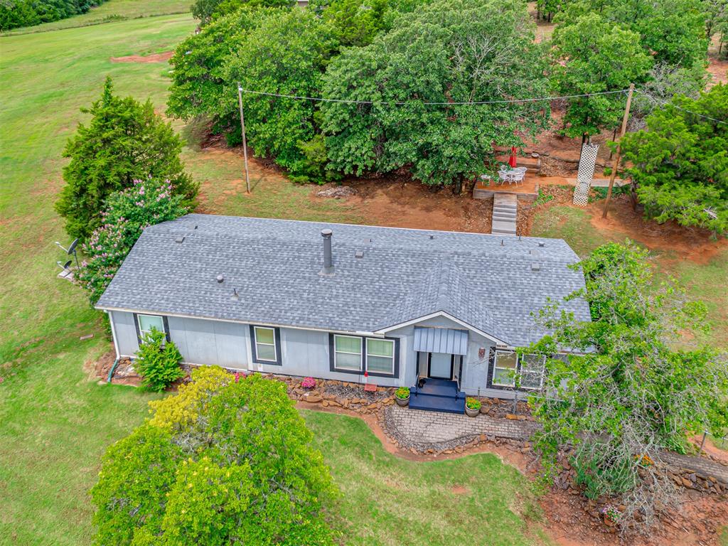 Your private country retreat awaits! Nestled on 5 peaceful acres, this well-cared-for 3-bed, 2-bath home offers the perfect blend of comfort, privacy, and functionality. Surrounded by mature trees and serene outdoor setting, you’ll love the quiet evenings and open space this property provides.

Key updates include a new condenser and furnace (2025), dishwasher (2023), and a newer roof on both the home and garage/shop (approx. 2019). The home features a thoughtful floor plan with fresh paint in the kitchen, living, dining, den, and spare bath (2024). 

Outside, the property shines with a spacious detached 3-car garage/workshop (approx. 1,600 sqft), an additional outbuilding with electricity, lean-to, storm shelter, and a paved driveway. An invisible fence surrounds the entire property, making it a pet-friendly haven.

Whether you’re envisioning your very own hobby farm, need extra space for tools and equipment, or simply want room to relax, this property checks all the boxes.

Located in the award-winning Edmond Public School District, you’ll enjoy the peace of country living with the convenience of town just minutes away.

Schedule your showing today and experience the best of country living in Edmond!