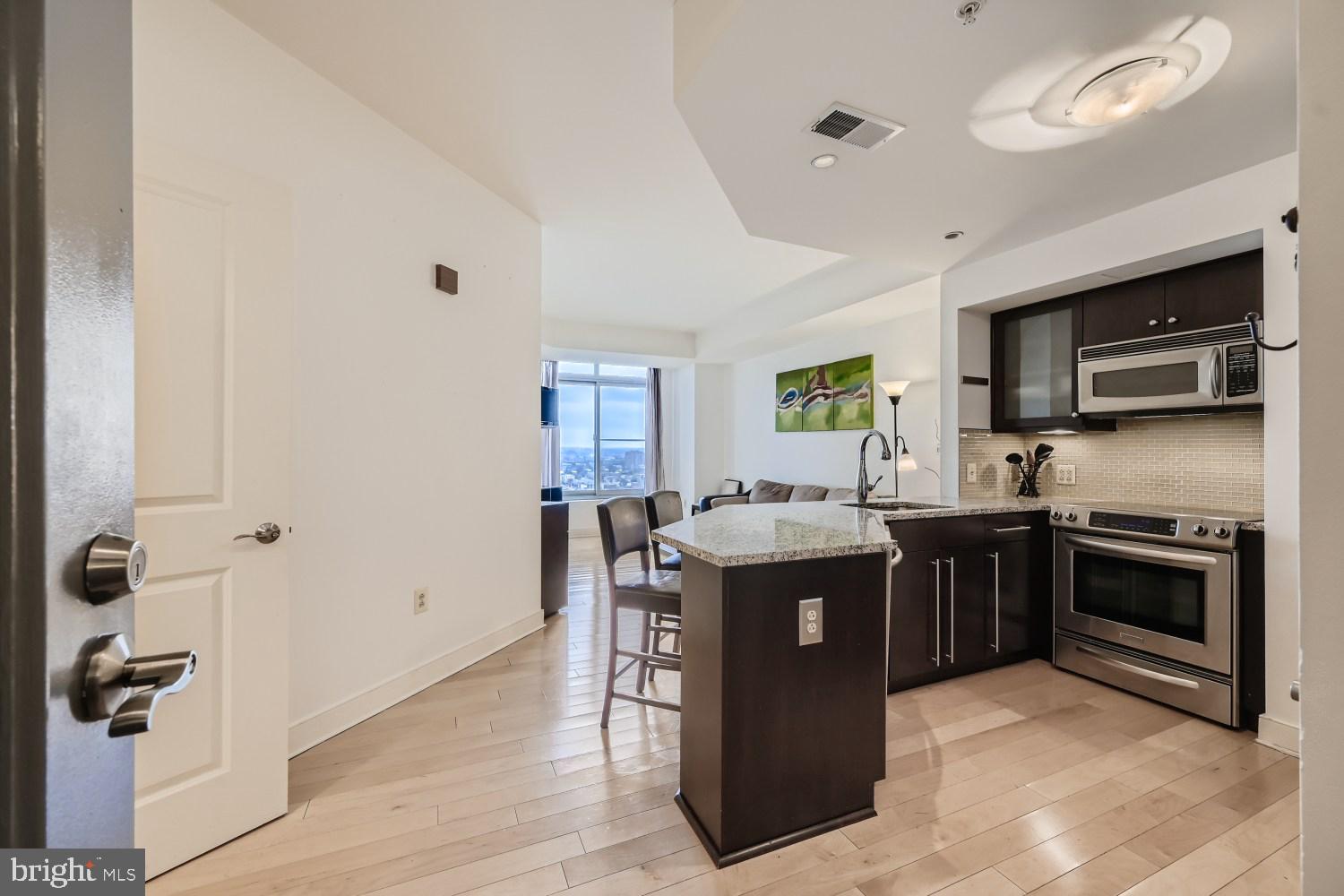 Stunning one bedroom one bath condo for lease in The Vue condominium. This residence features oversized windows, hardwood floors, open kitchen with breakfast bar, granite counters, glass tile backsplash, large primary bedroom with walk-in closet and spa-like bathroom. One assigned parking space included in the lease. Available furnished or unfurnished. The Vue condominium is located in Harbor East, Baltimore's most desirable neighborhood within steps to the finest restaurants, boutique shops, Whole Foods, Starbucks, the Inner Harbor, waterfront and nightlife. Conveniently located to I-83. Take the elevator to the MAC gym or the Harbor East Cinemas.