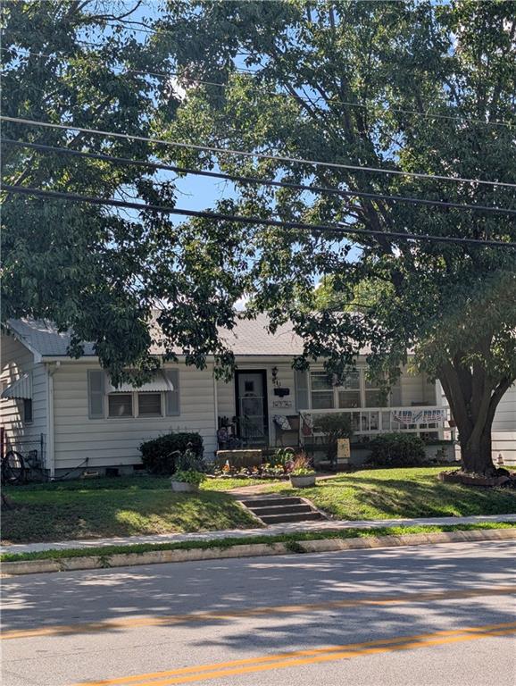 Charming home with several extra features. Recent bath $12,000 bath remodel with a large walk in shower. The home sits on a pretty shaded corner lot with plenty to enjoy including fenced yard, deck, porch, covered patio, lots of pretty flowers, 2 storage sheds, garden area... The property has a guest house that has a bathroom & heat & air. Ideal for additional family living space, guest lodging, teenagers space, craft/hobby room, which it's currently being used for sellers quilting hobby... Kitchen appliances stay with the property. Lots of vehicle space with both a 2 car garage & a carport. Nice location, making it easy to get to the schools, city events, shopping... Easy access into the house & for moving things in & out with a ramp at the back of the house. Looking for relaxing living, you will enjoy this home, Give Joann Cash a call to look today.