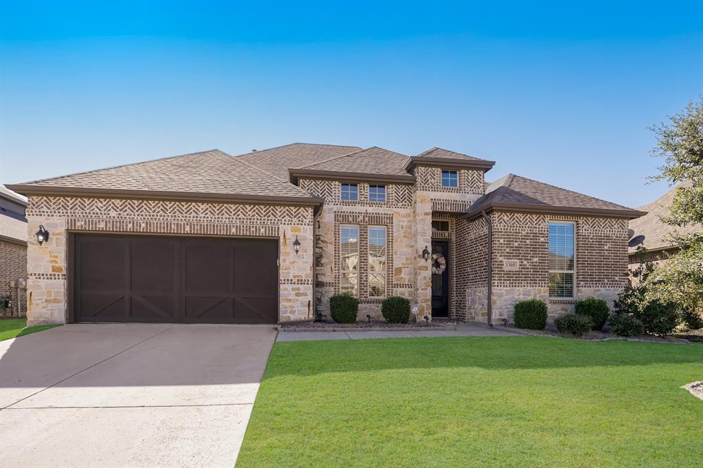 Stylish Simplicity Meets Prime Location! This Northeast-Facing, beautifully crafted one-story Dunhill home is located in the sought-after Valencia on the Lake community—just minutes from PGA Headquarters and offering easy access to Lake Lewisville! Thoughtfully designed for everyday living and entertaining, offering 3-bedroom, 2.5-bathroom, an open concept floor plan with 2,637 square feet of open-concept living space, all nestled on an expansive 7,825 sq ft lot. New Roof & Flooring (2024) - Hardwood Floors,  Open Layout, Natural Light - Covered Front and Back Patios - Large Kitchen and Dining Area - Spacious Split Primary Suite with an En-Suite Bath! Resort-Style Community Amenities: Swimming Pools - Fitness Center - Tennis & Sand Volleyball Courts - Clubhouse & Playground - Direct Lake Access. This home is move-in ready and ideal for families, professionals, or anyone seeking a peaceful community lifestyle with quick access to major highways, shopping, and recreation. Contact your agent today for a private showing. This opportunity won’t last.
