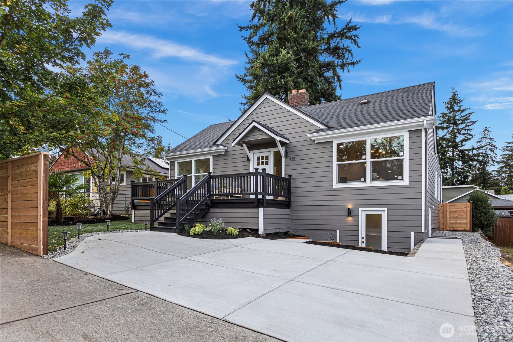 Thoughtful modern updates meet complete peace of mind in this fully transformed, turn-key North Seattle home! Fully permitted and impeccably renovated from top to bottom with quality craftmanship, this residence offers a seamless blend of timeless style, high-end finishes, and modern functionality. Beautiful luxury vinyl plank flooring, abundant natural light, and inviting open-concept living spaces welcome you inside. The chef-inspired updated kitchen features stylish cabinetry, sleek quartz countertops, a designer backsplash, and premium stainless steel appliances.    Designed for effortless modern living, the main level offers 3 spacious bedrooms, including a serene primary suite complete with a fully finished private bath. Downstairs, the versatile lower level boasts a fully permitted private 1-bedroom suite with its own separate entrance-an ideal layout for a MIL suite, long-term rental income potential, house hacking, or working from home.    Step outside to enjoy low-maintenance refreshed landscaping, a generous yard, and private outdoor entertaining spaces perfect for summer gatherings. Featuring a complete 4-bedroom, 3-bath layout, this move-in-ready home leaves nothing to be desired. Pre-inspected for added confidence and peace of mind. Unbeatable, central location just minutes to vibrant neighborhood parks, local dining, cafes, light rail, and major commuter routes for a seamless commute to Downtown Seattle or the Eastside.