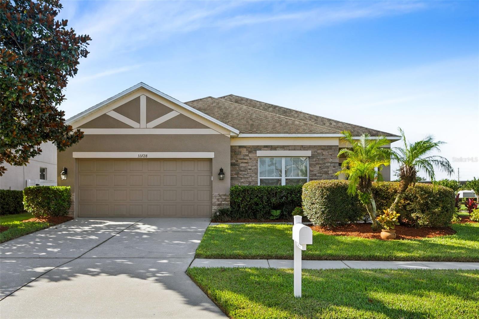 **** BRAND NEW ROOF WILL BE INSTALLED BEFORE CLOSING WITH A FULL PRICE CONTRACT **** Move-in ready! Adorable & affordable! Location, location, location! Beautifully maintained home situated on a large, almost ¼-acre lot in the highly sought-after community of Hamilton Park. No CDD and low HOA fees help keep ownership costs affordable! This spacious one-story home offers 2,112 sq. ft. of living space with a fantastic open floor plan featuring 3 bedrooms, 2 baths, a 2-car garage, plus a versatile flex room that can be used as a formal dining room, living room, home office, den, or potential 4th bedroom. Step inside to a welcoming foyer and spacious open living areas. Enjoy ceramic tile and wood laminate flooring throughout with no carpet! The beautiful open kitchen features 42” cabinetry with crown molding, under-and above-cabinet lighting, granite countertops, recently updated stainless-steel appliances including a new dishwasher, microwave that vents to the exterior, stainless-steel basin sink, pantry, and a large center island with breakfast bar. The huge primary suite offers plenty of room including a sitting area along with a walk-in closet. The primary bath features a granite double-sink vanity, garden soaking tub, and large walk-in shower with upgraded tile. Two additional spacious bedrooms share a second full bathroom. The spacious living area with high ceilings is perfect for entertaining, while sliding glass doors lead to the private, extended covered and screened lanai—the perfect place to relax and enjoy Florida evenings and beautiful sunsets. The oversized backyard provides plenty of room for entertaining, BBQs with family and friends, pets, gardening, or simply enjoying the outdoors. Additional features and updates include: New roof to be installed before closing with a full-price contract, A/C 2021, water heater approximately 7 years old, updated ceiling fans, smoke detectors, wood laminate flooring, garage door opener, Rain Bird irrigation controller, and much more! Hamilton Park offers a community park, playground and picnic area and is conveniently located near golf courses, shopping, restaurants, hospitals, Flatwoods Preserve, Wiregrass Mall, Tampa Premium Outlets, The Grove, entertainment, and major roadways including I-75, I-275 and I-4, with convenient access to Downtown Tampa and Tampa International Airport. Move-in ready, spacious lot, no CDD and low HOA—this home is a must-see! Schedule your private tour today!