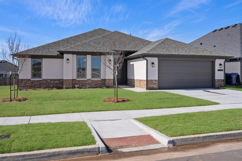 Price Reduced Open Living with Tandem Garage and Luxe Primary SuiteThis move-in-ready home brings everyday living together in all the right ways. The open kitchen connects easily to the dining space and living room, making gatherings feel natural and relaxed. Quartz countertops, a gas range, built-in appliances, and a generous pantry keep the kitchen both practical and polished, while wood flooring and a cozy fireplace anchor the main living areas.The primary suite feels calm and inviting with a spacious layout, a tiled shower, double vanities, a soaking tub, and a large closet with seasonal storage that opens directly to the laundry room. A covered back patio, powder bath, and three-car tandem garage add comfort and flexibility for daily life.Energy efficiency is guaranteed through our partnership with Environments for Living, ensuring predictable heating and cooling costs with potential reimbursement if usage exceeds expectations. With our Your Way* incentive, you can enhance your home with options like a storm shelter, full home blinds, or apply the credit toward closing costs or interest rate buy-downs.Native Plains provides a quiet country ambiance with walking trails, a dock for fishing at the stocked pond, and a distinctive playground. Conveniently situated near I-35, it offers quick access to downtown Oklahoma City, making it an ideal blend of tranquility and accessibility.Included features: * One-year builder warranty* Two-year systems warranty* 10-year structural warranty* Certified energy advantage guarantee for heating and cooling costs* Fully landscaped front & backyard * Fully fenced backyard* Full gutteringThe floor plan and description may differ slightly from the completed home.