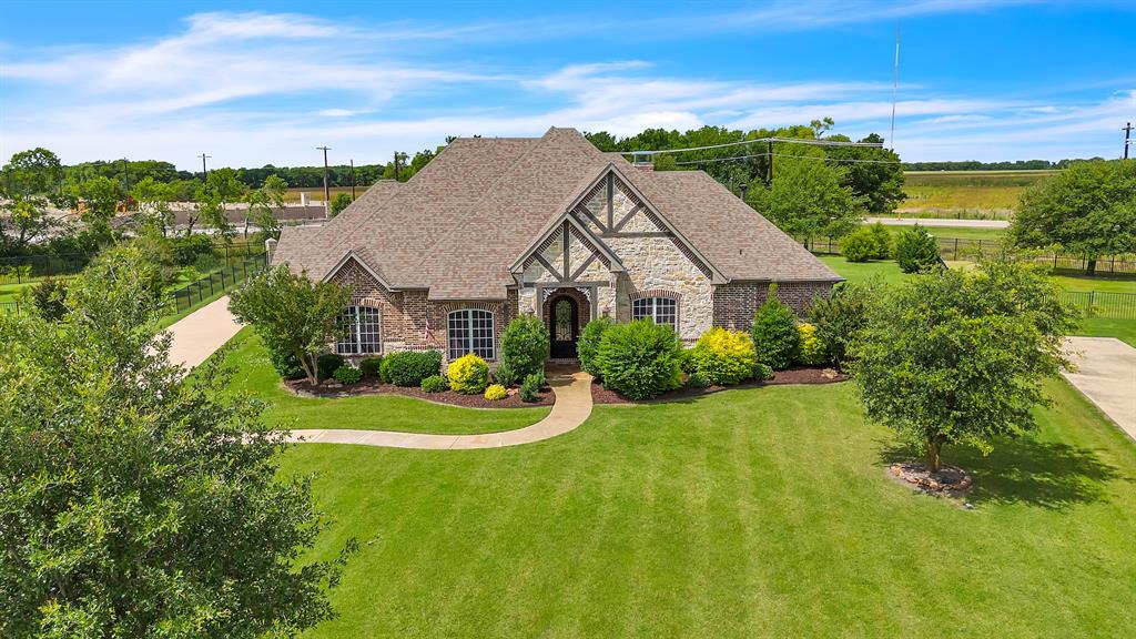 Discover refined living in this exquisite custom-built, single-story home nestled on a sprawling 1.44-acre lot within the gated Waterstone Estates. Boasting four bedrooms, 3 and a half baths, and a three-car garage, this property offers an open floorplan highlighted by two spacious living areas. Designed with privacy in mind, the thoughtful four-way bedroom split ensures peaceful retreats. Three bedrooms feature en suite baths, two sharing a Jack & Jill bath, while the fourth is served by an adjacent hall bath.  The chef’s dream kitchen includes an oversized island and custom cabinetry, perfect for culinary enthusiasts. Step outside to enjoy the screened-in patio complete with a cozy fireplace, seamlessly expanding your living space. The backyard oasis delights with a heated saltwater pool, spa, and a charming pergola for endless outdoor enjoyment.  With the second living area offering a convenient half bath and garage access, this home is perfect for entertaining. Country living just outside McKinney city limits, with downtown McKinney just a short drive away!