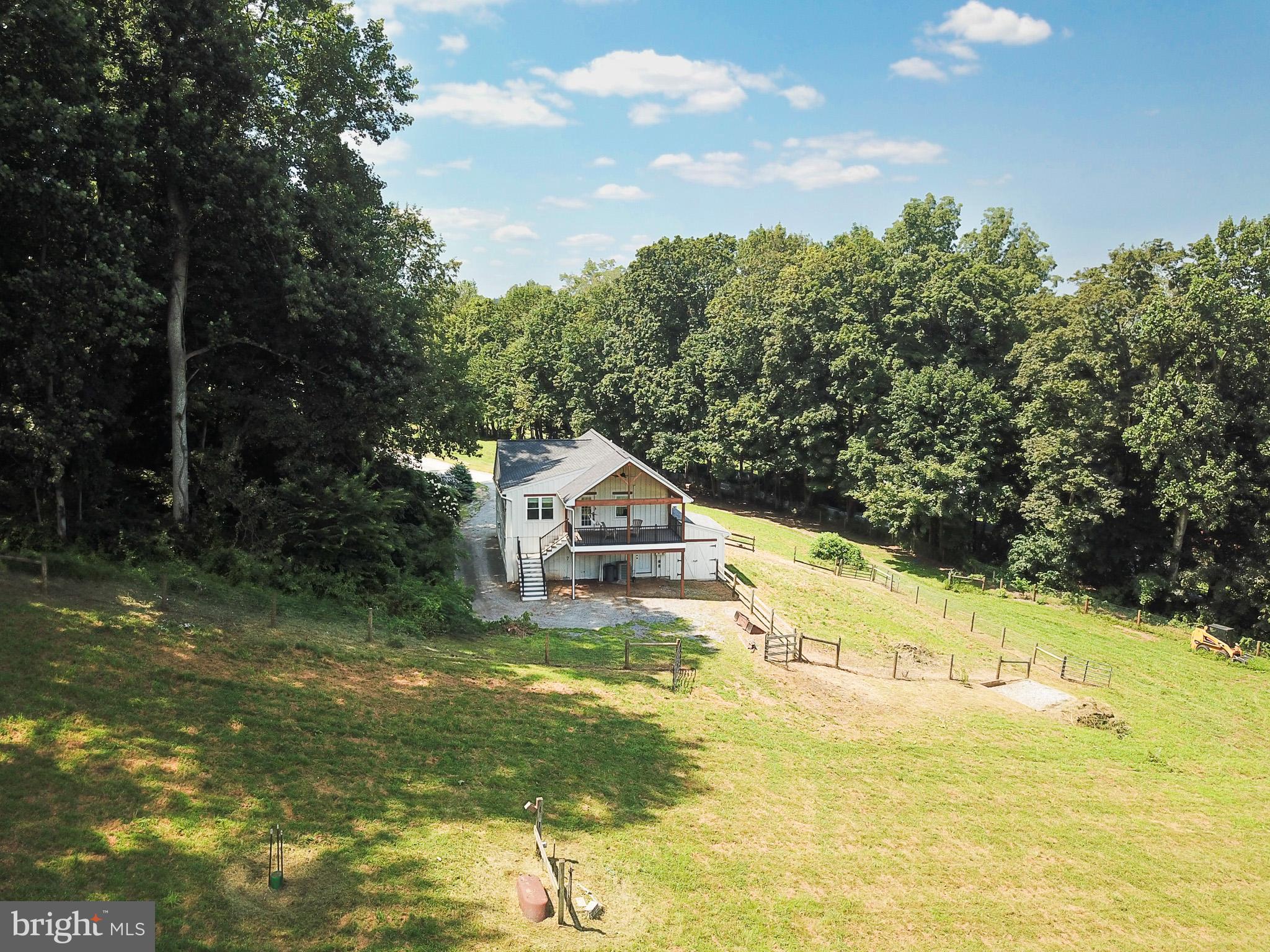 A rare, 26.4-acre equestrian haven in Unionville–Chadds Ford. About eight acres of open pasture roll into woodlands with a meandering creek and private trails—an ideal setting for training, hacking, and year-round turnout. A well-designed 4-stall barn with a heated tack room anchors the horse infrastructure, with ample space for equipment, hay, and trailer parking.The existing, warmly updated converted-barn residence offers immediate, comfortable living (or a superb farm manager/guest option) while you plan and create a spectacular primary residence tailored to your vision—capturing long views over pasture and forest. Here, you can craft a true Chester County farmette or private estate with everyday convenience to downtown West Chester and Kennett Square, yet the quiet of Pocopson Township’s countryside.Equestrian potential, estate-caliber setting, top-tier schools—this is the canvas to build the life you want.