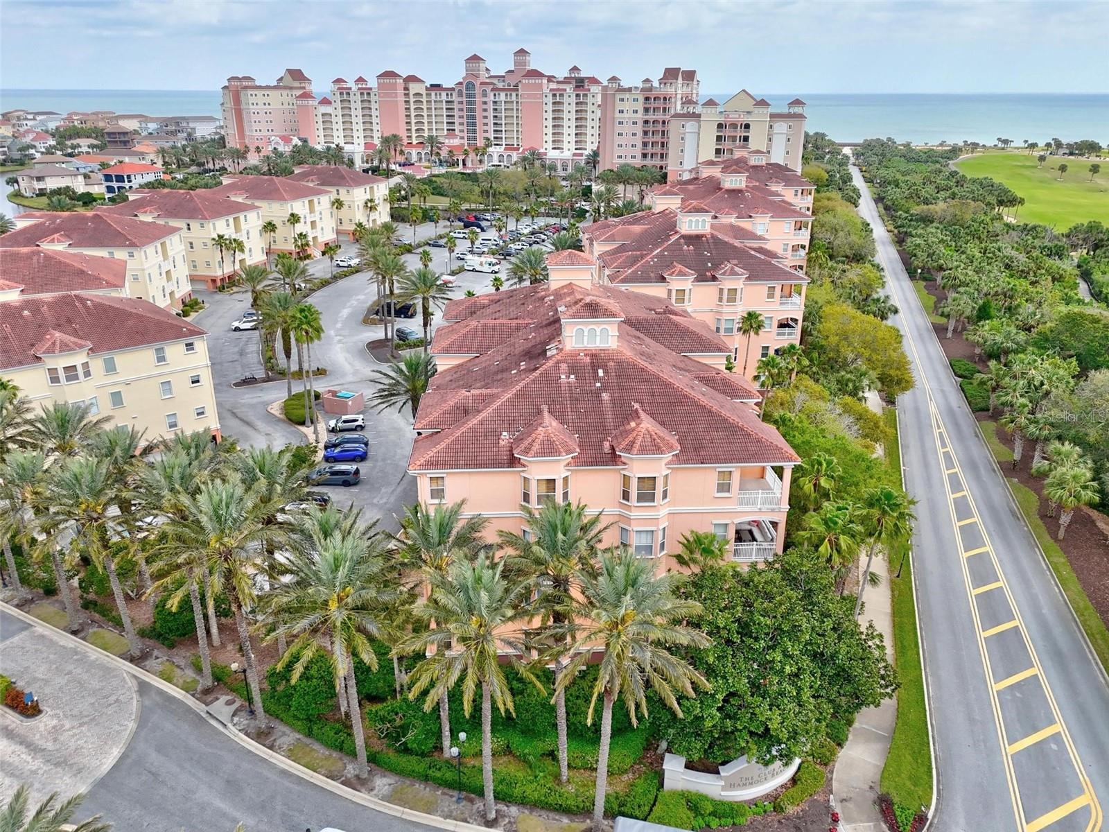 Welcome to this light-filled 3rd-floor villa at Hammock Beach Resort, where ocean and golf course views pair with the ease of resort living. Positioned as an end unit, the residence benefits from an abundance of windows and natural light throughout its 3-bedroom, 2-bath layout. A tiled foyer welcomes you inside, complemented by elegant archways and built-in arched wall niches that add architectural character.Luxury vinyl flooring extends through the main living spaces, accented by crown molding and a bright, open feel. The kitchen features granite countertops, stainless steel appliances, and a window-lined eat-in nook, while the adjoining dining and living areas create a comfortable space for both everyday living and entertaining. Sliding glass doors open to a covered patio overlooking the Atlantic Ocean and the Jack Nicklaus-designed Ocean Course—the perfect setting to enjoy the coastal surroundings.The primary suite offers a private retreat with plush carpeting, a walk-in closet, and a spacious bath complete with dual vanities, a soaking tub, and a walk-in tiled shower. Two additional bedrooms with brand new LVP flooring and a full guest bath are thoughtfully positioned toward the front of the villa, providing separation and privacy for family and guests. A generously sized laundry room adds valuable storage and everyday functionality.Ownership at Hammock Beach Resort provides the opportunity to enjoy an exceptional collection of amenities, including two championship golf courses, multiple pools, fitness facilities, on-site dining, and more. Whether used as a full-time residence, coastal getaway, or vacation property with rental income potential, this villa offers a comfortable and low-maintenance way to experience everything Hammock Beach has to offer.