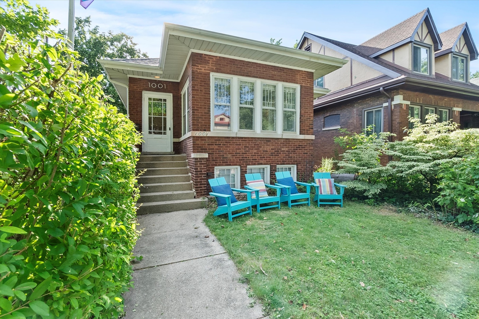 Still searching for your Oak Park home? This expanded corner bungalow might be the one. Bathed in natural light thanks to its prime corner lot, with just shy of 2,000 square feet of flexible living space, this home offers the perfect blend of vintage charm and modern updates-think original stained glass windows and a decorative fireplace-with a layout that works for real life. The first floor flows beautifully from the updated kitchen (quartz countertops, stainless steel appliances, smart layout) into the dining and living areas. Two main-floor rooms offer flexibility: bedrooms, offices, or cozy dens-you decide. Upstairs you'll find three generously sized bedrooms and a half bath, with potential to dormer out and add a full primary suite. The finished basement offers high ceilings and even more space: a TV room, home studio, and dedicated workshop. 2024 updates include a brand-new furnace and A/C. Roof is just 10 years old. This is a home with room to grow, live, and make your own.