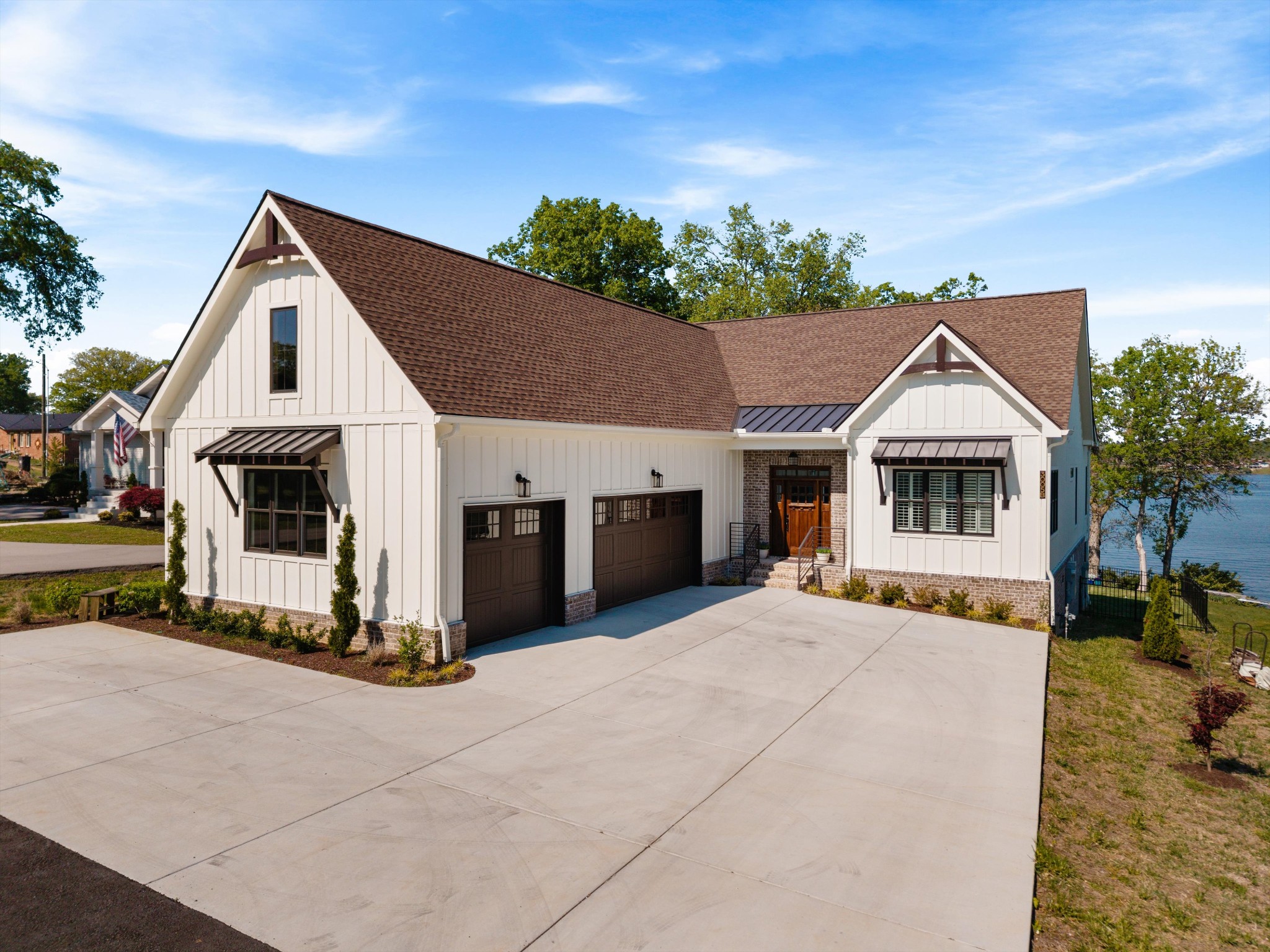 Rare Lakefront Compound | Old Hickory Lake | 393 Ft Main Channel Frontage | Two Homes393 feet of deep water main channel frontage. 34 feet deep. On Old Hickory Lake.That alone is the story. But there's more.Two completely separate Homes sit on this compound, starting with a stunning 3,500 sq ft NEW CUSTOM construction primary residence built specifically for lakefront living. Three lake-facing patios, dedicated waterfront entertaining space, an in-home elevator, Murphy beds, and private en-suite baths throughout. Every single detail was chosen with intention.Outside, your private dock and a sailboat convey with the property. On 393 feet of main channel frontage that almost never hits the market.The second dwelling is a fully equipped 3-bedroom cottage with a complete kitchen. Guest house. In-law quarters. Income-producing rental. The flexibility alone exponentially increases what this compound is worth.Deep water MAIN CHANNEL. 393 feet of frontage. A dock, a sailboat, three lake-facing patios, an elevator, and real income potential.