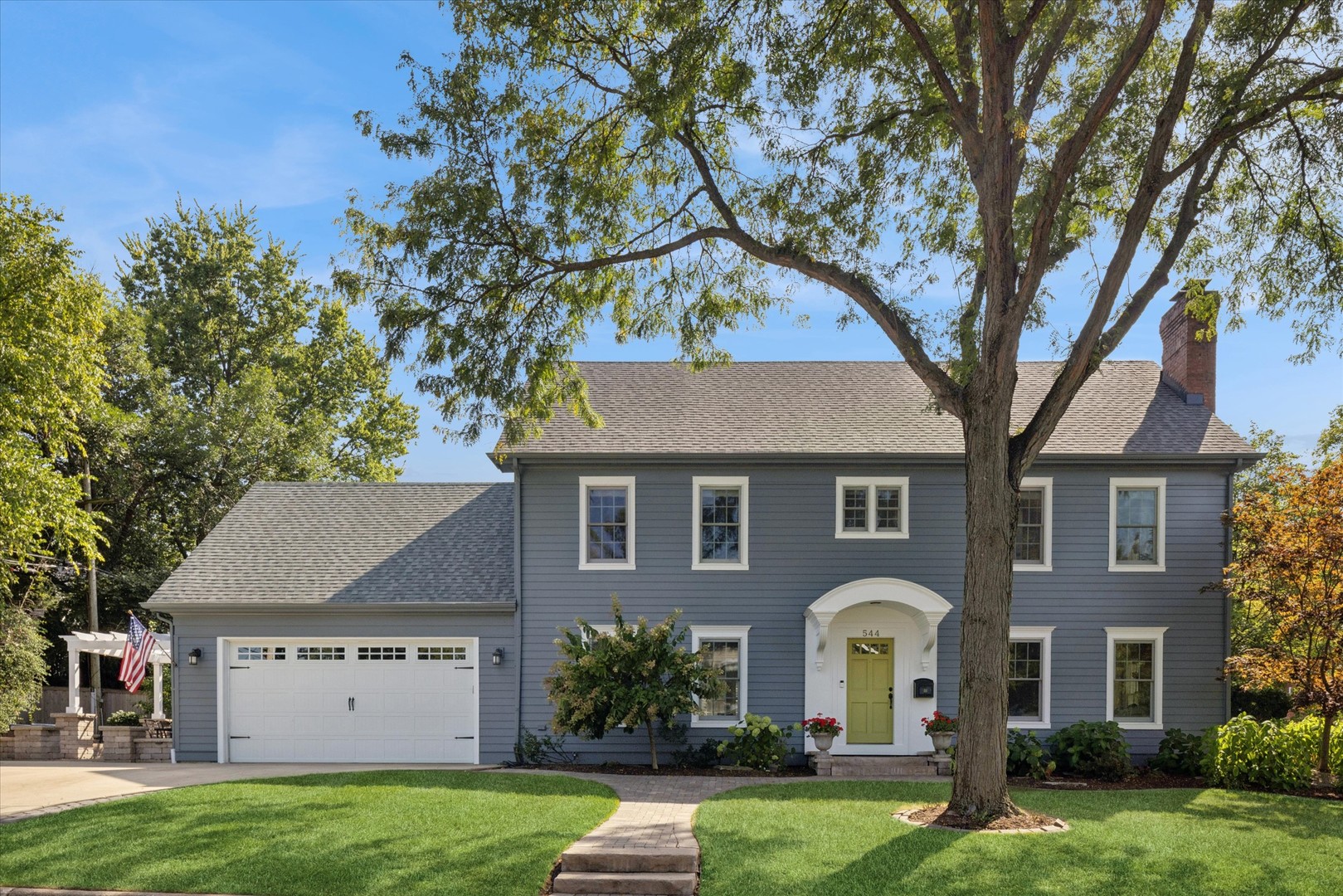 Unbeatable Hinsdale location! This classic Colonial is just a block from Robbins Park (east) and Dietz Park (west), and a short 3 min walk to double-Blue Ribbon award winning Madison Elementary School.  You'll love the expansive square footage and flexible layout with ample space for your lifestyle.   The family room is neutral and warm, featuring built-in bookcases and a beautiful fireplace.   The gorgeous white kitchen features abundant counter space, island, and breakfast area. 1st floor also features a separate dining room, office/play room, and mudroom with floor to ceiling cabinets sufficient to handle the day-to-day.    5 spacious bedrooms and 3 full baths on 2nd floor. Master bedroom features dual vanity sink, built out closet, large shower, and wood burning fireplace.  Second full size laundry on the 2nd floor making laundry a breeze.  The basement has a large recreation room and ample storage, plus another laundry room.    The exterior space is a true second living room, with an oversized brick paver patio, fire pit, built in grill and wine fridge, making entertaining fun and easy.   You'll love the hardwood floors, bonus rooms, space to grow, and attached garage.   New roof in 2023. This house is move-in ready, is walk to EVERYTHING, and is a location that you cannot fully appreciate until you're here...with one of Hinsdale's most enviable block parties, Madison Dash and Bash and Rotary run going by your front door, and new friends to be found everywhere.  Move quickly, as this one won't last long!