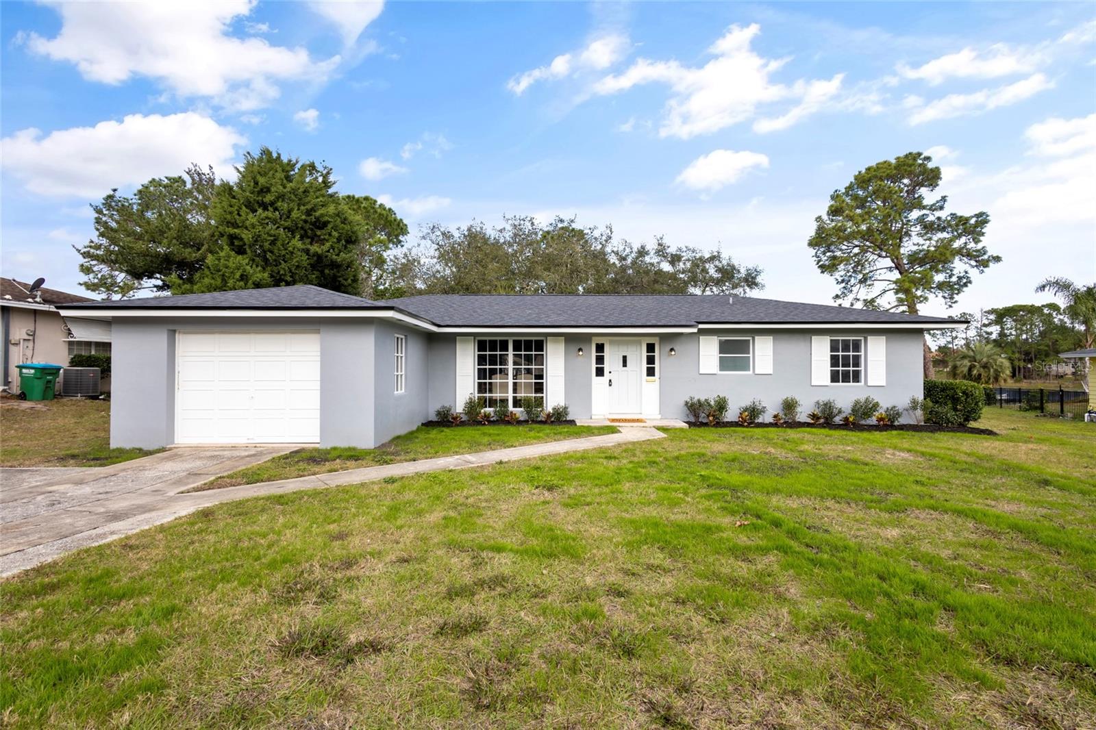 Welcome to your dream home at 1566 Findlay St, Deltona, Florida, where luxury living meets breathtaking views! This exquisite pool home offers a perfect blend of style, comfort, and modern sophistication, making it a standout property in the sought-after Lake Tivoli neighborhood. *** utilize our preferred lender and they will cover up to $750 towards your appraisal. Step inside to discover a fully remodeled interior that seamlessly combines contemporary elegance with timeless charm. Every detail has been thoughtfully curated, from the sleek flooring to the designer fixtures, creating a welcoming and visually stunning living space. The new roof and air conditioner ensure not only a chic aesthetic but also worry-free living, providing you with the peace of mind you deserve. This home features an open-concept layout, allowing for seamless flow between the living, dining, and kitchen areas. The kitchen is a culinary enthusiast's delight, boasting top-of-the-line appliances, stylish cabinetry, and ample counter space. It's the perfect space for entertaining friends and family or enjoying intimate meals with a view. As you make your way to the outdoor oasis, you'll be captivated by the sparkling pool and the serene backdrop of Lake Tivoli. Whether you're lounging by the poolside, hosting a barbecue, or simply enjoying the sunset over the water, this backyard paradise offers the ideal setting for creating lasting memories. The master suite is a true retreat, featuring a spacious layout, a meticulously designed en-suite bathroom, and private access to the outdoor space. Three additional bedrooms provide versatility for guests, a home office, or a growing family. Situated in the heart of Deltona, this property offers more than just a stunning residence – it provides a lifestyle. With easy access to local amenities, shopping, dining, and recreational opportunities, you'll experience the best that Central Florida has. Don't miss the chance to make this pool home on Lake Tivoli your own. Contact me today to schedule a private showing and start envisioning the luxury and comfort that await you in this exceptional Deltona residence!