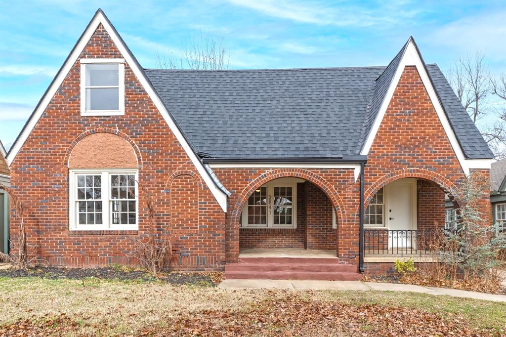Welcome to this beautifully restored 1930 Tudor in the highly sought-after Crestwood neighborhood—where timeless character meets thoughtful modern updates. Step into an expansive living area anchored by a stunning fireplace, flowing seamlessly into a flexible dining or secondary living space. The fully renovated kitchen blends history and design with brand-new appliances, custom cabinetry, quartz countertops, updated lighting, and a preserved original brick chimney now showcased as a striking focal point.Original hardwood floors run throughout the home and have been professionally refinished. The main level offers three generously sized bedrooms with ample closet space and 1.5 fully renovated bathrooms. A spiral staircase leads upstairs to a versatile, fully updated bonus space with a half bath—ideal for a primary suite, second living area, home office, or entertainment space.Both front and back landscaping have been completely redone, including new sod in the oversized backyard. The concrete drive leads to an updated detached garage and a brand-new stone entertaining area with fire pit, perfect for hosting and relaxing year-round. Additional upgrades include a new roof replaced in December 2023.Located just minutes from popular local restaurants, shops, and everyday conveniences, this home delivers charm, craftsmanship, and lifestyle in one exceptional package. Buyer to verify all information, including schools.