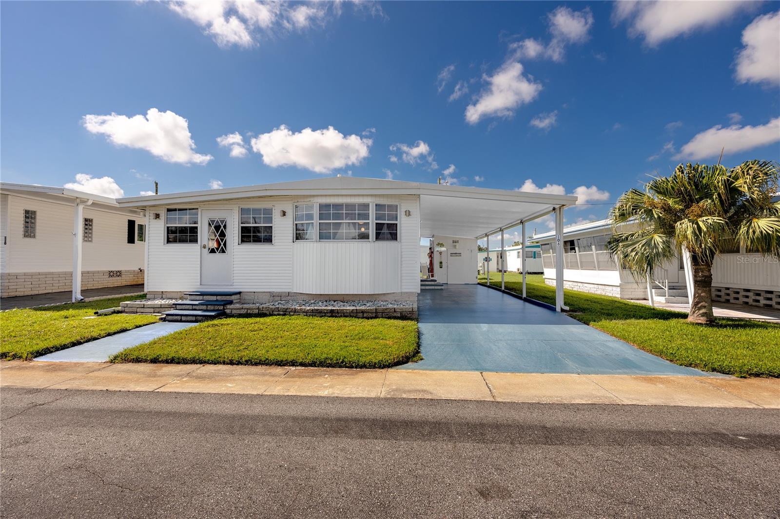 Welcome to Lake Highlander, an exclusive 55+ resident-owned community in the heart of Dunedin, Florida! This charming double-wide home is offered fully furnished and is tucked away on a quiet cul-de-sac, offering comfort, convenience, and a low-maintenance lifestyle in one of Pinellas County’s most desirable retirement destinations.

Inside, the inviting open-concept layout flows seamlessly with easy-care laminate flooring throughout. A versatile 2nd bedroom room can serve as a home office, craft studio, or guest bedroom, giving you flexibility to match your lifestyle. The home also provides abundant storage, a large covered carport, a separate storage shed with an interior laundry room, plus an additional shed for outdoor storage. For added peace of mind, the roof was replaced in 2019.

Lake Highlander is home to just 289 residences, ensuring a true sense of community with no short-term rentals allowed. Residents enjoy exceptional amenities, including a geothermal heated swimming pool, recreation center with bathrooms and stage, game room with billiards and card tables, community library, laundry center, and six shuffleboard courts. Scenic walking paths surround the lake and fountain, with an observation dock perfect for quiet afternoons by the water.

Monthly HOA fees are just $255 and cover water, sewer, trash, exterior maintenance, and access to all amenities. 

Discover a vibrant, welcoming 55+ lifestyle in a beautifully maintained Dunedin community, where comfort and convenience are built into every detail. Schedule your private tour today!