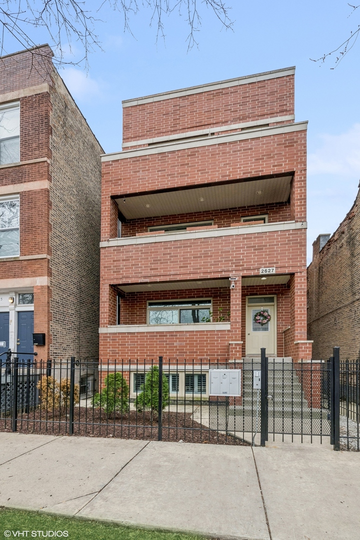 This spacious 4 bedroom 3 bathroom duplex-down with two living spaces in Ukrainian Village has 1 garage parking space included and 3 private outdoor spaces including a huge PRIVATE roof deck with pergola. With unique details such as a coffered-ceiling in the living room, custom organized closets throughout, full laundry room on the lower level, two fireplaces (one gas fireplace and one electric fireplace), lower level family room with wet bar and beverage fridge plus an additional storage area outside of the unit, this property checks every buyer's box. The living room features a fireplace and opens to a large front balcony, perfect for grilling, as well as a dining space that fits a table for 8 and opens to the kitchen. The large kitchen has soft close cabinets/drawers, granite counters, and stainless steel appliances as well as tons of counter space. The well-cared for unit features 4 large bedrooms (2 upstairs on the main level/2 bedrooms downstairs on the lower level) including a true master suite with walk-in closet and a full private attached bath with steam shower, multidirectional shower heads and tons of storage as well as a private outdoor space off the primary bedroom which can be accessed from the hallway. The second bedroom on this level easily fits a queen sized bed and has access to the hallway bathroom with Jacuzzi tub. The lower level has a huge family room with wet bar with wine/beverage fridge and the second fireplace as well as hardwood flooring throughout this level. Also on this level is the 3rd and 4th bedrooms which are very large, a full bathroom, the laundry room with side by side laundry, a wine/liquor closet and tons of storage. This is a 100% owner-occupied, self-managed 3 unit building. Assessments are low. Unit includes an additional storage area outside the unit.  Bike storage available in the owner's storage unit or in the garage.  Rentals allowed on a case by case basis with HOA approval. Building has over $5K in reserves with no upcoming specials or major work to be done.  Building owners handle snow removal. Great location; walk to Wicker Park, Bucktown, the Blue El line and more. Street permit parking.