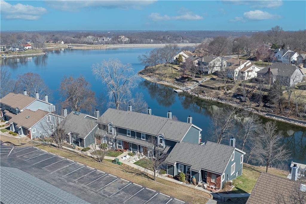 Opportunity Knocks!  Rare find of a Lakefront Townhome with an owned Detached Garage!  Awesome location on premium lake frontage and a Swim Dock conveniently located just out your back door.  This Townhome has a Newer Roof,Siding, a beautiful new Trex Deck and Railing so great curb appeal and its own Detached Garage while many in this area have to lease garages.  The maintenance pkg in Bayview is exceptional offering Exterior Building Maintenance for Siding and Roof, Property Insurance, Lawn, Snow, and Trash.  This 2 Bedroom, 1.5 Bath home has beautiful Wood Floors on the main level and includes a Finished Walkout Basement.  Keep your kayak handy on the back Patio and spend many beautiful days boating, swimming, and enjoying all the amenities of Lakewood including Golf, Clubhouses, Sports Courts, Multiple Pools, and Trails.