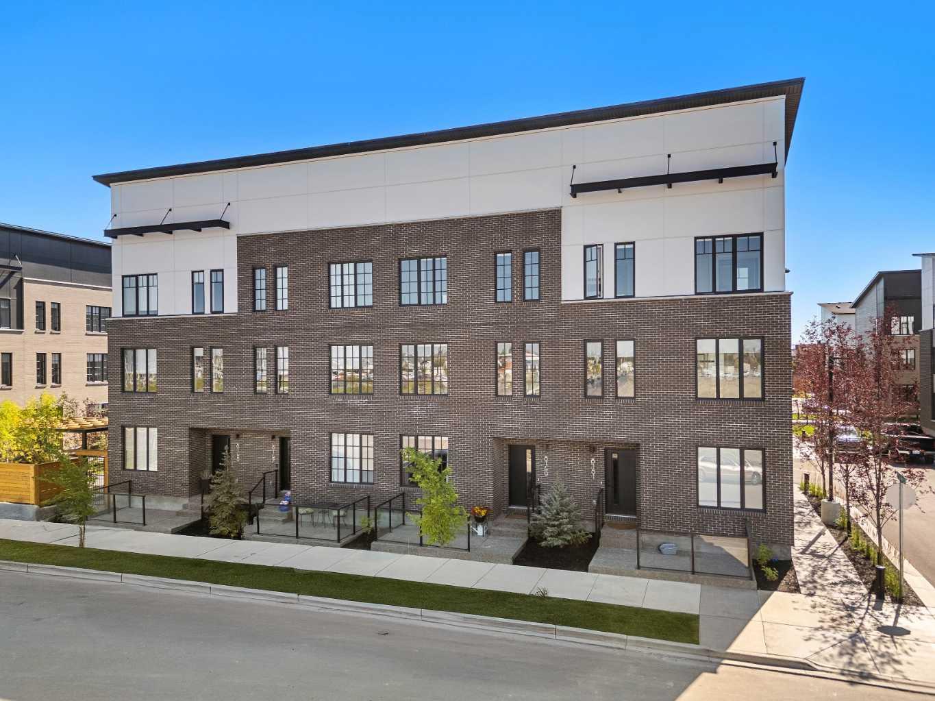 **OPEN HOUSE SATURDAY OCT 25TH NOON - 2:00PM** BEST PRICE IN THE DEVELOPMENT ** WELCOME TO 8149 8 AVENUE SW, an EXQUISITE TRUMAN-BUILT RESIDENCE that redefines MODERN SOPHISTICATION in the prestigious community of WEST SPRINGS. Offering OVER 1,800 SQ. FT. OF IMPECCABLY DESIGNED LIVING SPACE, this home perfectly blends TIMELESS ELEGANCE with THOUGHTFUL FUNCTIONALITY.

Step inside to a WELCOMING FOYER that immediately sets the tone for the home’s REFINED INTERIORS. Just off the entrance, a VERSATILE PRIVATE OFFICE provides the perfect setting for professionals or students seeking a dedicated workspace—or it can easily serve as a THIRD BEDROOM.

The main living level showcases an OPEN-CONCEPT DESIGN where NATURAL LIGHT pours through EXPANSIVE WINDOWS, highlighting the seamless flow between the LIVING ROOM, DINING AREA, and CHEF-INSPIRED KITCHEN. The space is enhanced by WIDE PLANK LUXURY VINYL FLOORING THROUGHOUT, creating a SOPHISTICATED AND COHESIVE LOOK. Designed for both STYLE AND PERFORMANCE, the kitchen features CUSTOM CABINETRY, STRIKING QUARTZ COUNTERTOPS, and an IMPRESSIVE LINEUP OF PREMIUM APPLIANCES—including a FULLY PANELLED FISHER & PAYKEL 36" FRENCH DOOR REFRIGERATOR WITH ACTIVE SMART TECHNOLOGY, a GAS RANGE, a BUILT-IN MICROWAVE, and a STAINLESS STEEL DISHWASHER. A GENEROUS CENTRAL ISLAND anchors the space, providing AMPLE ROOM FOR CULINARY CREATIVITY AND EFFORTLESS ENTERTAINING.

From the dining area, step out to a PRIVATE BALCONY—a SERENE RETREAT that includes an A/C ROUGH-IN, perfect for enjoying MORNING COFFEE OR EVENING RELAXATION.

Upstairs, discover TWO SPACIOUS DUAL PRIMARY BEDROOMS, each complete with its own PRIVATE ENSUITE for ULTIMATE COMFORT AND PRIVACY. The PRIMARY SUITE is a true sanctuary, showcasing LARGE WINDOWS and a SPA-INSPIRED FIVE-PIECE ENSUITE featuring a DEEP SOAKING TUB, DUAL VANITIES, and a GLASS-ENCLOSED 10M SHOWER.

The DOUBLE ATTACHED GARAGE is as polished as the interiors, boasting FRESHLY PAINTED WALLS and SLEEK EPOXY FLOORING, making it ideal for vehicles or ADDITIONAL STORAGE.

WEST SPRINGS stands as one of CALGARY’S MOST PRESTIGIOUS COMMUNITIES, offering an UNPARALLELED LIFESTYLE where ELEGANCE MEETS CONVENIENCE. Perfectly positioned along the CITY’S WESTERN EDGE, this coveted neighbourhood blends SOPHISTICATED LIVING with BREATHTAKING NATURAL SURROUNDINGS. MEANDERING PATHWAYS, LUSH GREEN SPACES, and QUICK ACCESS TO THE MAJESTIC ROCKY MOUNTAINS create an idyllic setting for outdoor enthusiasts. Meanwhile, VIBRANT BOUTIQUE SHOPPING, FINE DINING, and PREMIUM AMENITIES are just moments from your doorstep. Known for its TOP-TIER SCHOOLS, SERENE AMBIANCE, and EFFORTLESS CONNECTIVITY TO DOWNTOWN VIA BOW TRAIL AND STONEY TRAIL, West Springs offers a REFINED YET RELAXED WAY OF LIFE, making it a PREMIER DESTINATION FOR THOSE WHO SEEK BOTH LUXURY AND LIVABILITY.