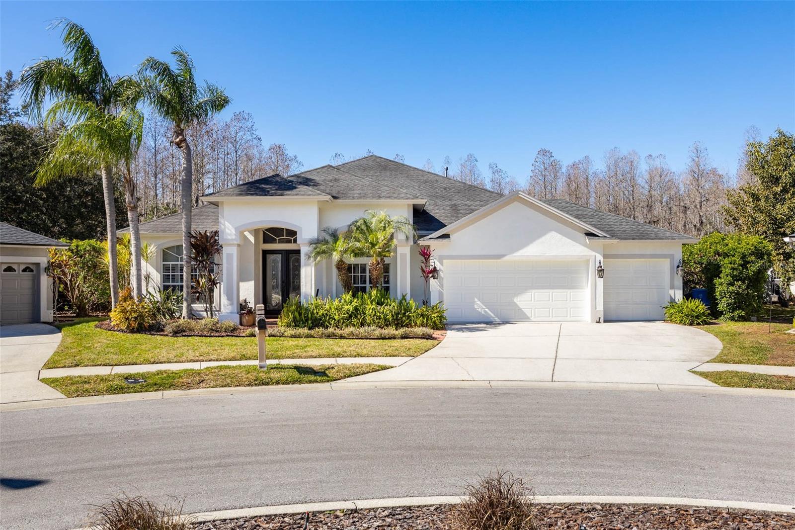 Welcome to this beautifully designed one-story pool home, perfectly situated on a quiet cul-de-sac and backing to a serene conservation lot with no rear neighbors. Offering 4 bedrooms plus a dedicated office, 3 full bathrooms, and a 3-car garage, this home combines space, privacy, and functionality. The thoughtfully designed split floor plan places three bedrooms on one side of the home while the private primary suite is tucked away on the opposite side. At the heart of the home, an open and airy layout seamlessly connects the kitchen, dining room, and living room, creating the perfect setting for everyday living and entertaining. The home is also equipped with a water purification system, adding an extra layer of comfort and convenience to daily living. Sliding doors open to a private outdoor retreat featuring a screened-in, solar-heated pool, offering energy-efficient enjoyment year-round. The expanded backyard is designed for fun and relaxation, showcasing an expansive turf area with a putting green, a full-size bocce ball court, and a large exterior chess set—all set against peaceful conservation views with no backyard neighbors. Additional highlights include a generator-ready setup with a dedicated pad and connector, providing peace of mind and preparedness. Whether hosting gatherings or enjoying quiet evenings at home, this property delivers exceptional indoor-outdoor living, privacy, energy-conscious features, and a prime cul-de-sac location—all on one level.