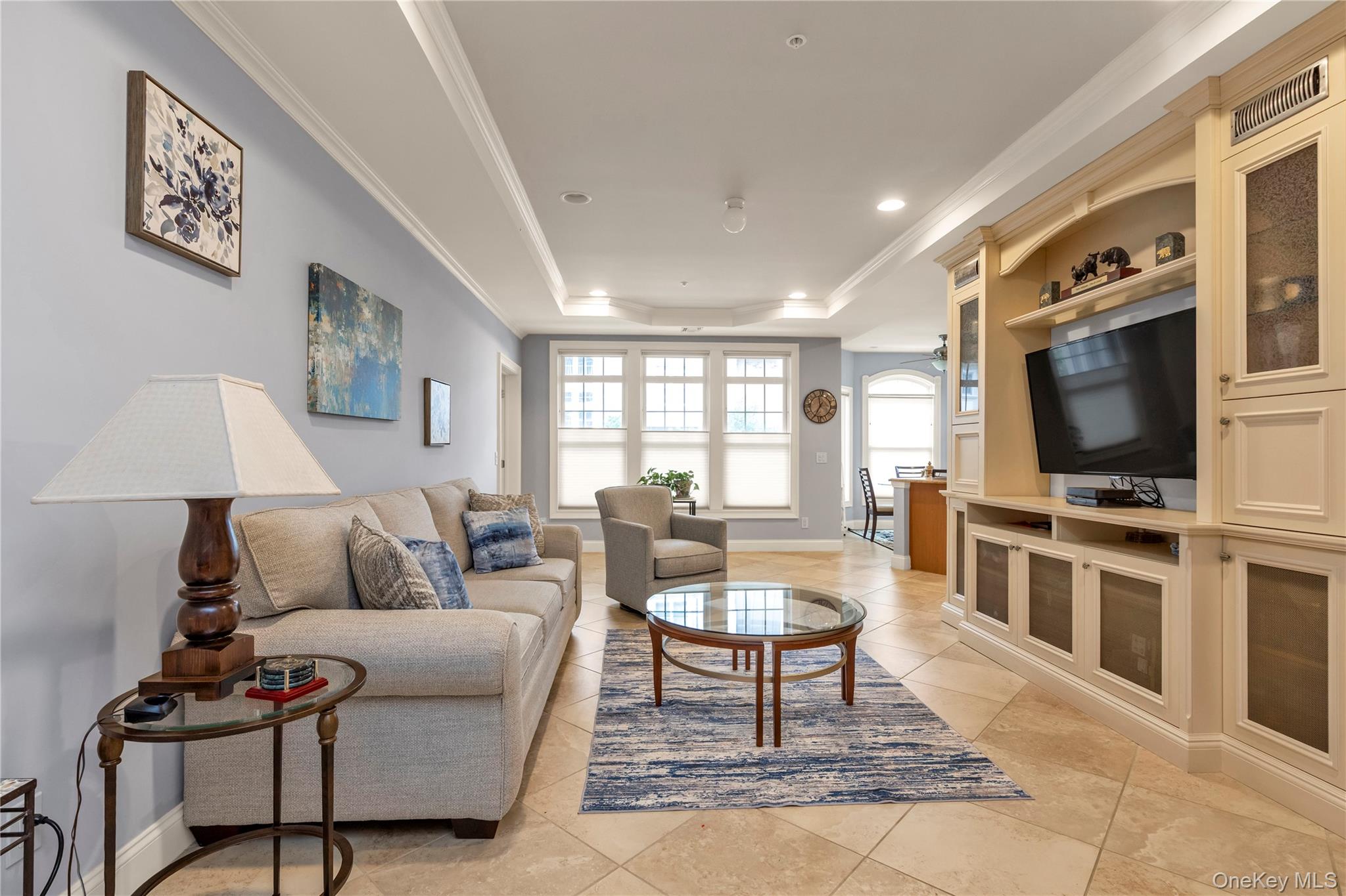 Welcome home to luxury living in the gated Meadowbrook Pointe Athletic Club & Spa community! This spectacular 2-bedroom, 2-bathroom residence features a light-filled open layout with a custom kitchen and sunny breakfast nook. The spacious living room shines with 9-foot tray ceilings and a high-end custom built-in entertainment center.The primary suite fits a king-sized bed comfortably and boasts custom walk-in closets along with a private ensuite bathroom featuring a sleek walk-in shower. A versatile second bedroom easily serves as a den or home office. Complete with an in-unit laundry room, assigned parking, and dedicated storage. Just steps away, the resort-style clubhouse offers indoor and outdoor pools, a state-of-the-art fitness center, on-site beauty salon, library, movie theater, ballroom, tennis, and bocce courts. Schedule your showing today before it’s gone!