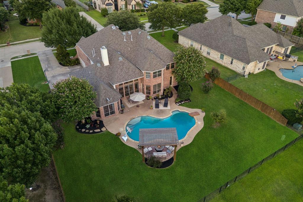 Tucked away on a quiet cul-de-sac in one of Keller’s most sought-after neighborhoods, this beautiful two-story home offers the perfect blend of privacy, space, and convenience on over half an acre. Backing to a scenic greenbelt, the backyard provides peaceful views and a private setting rarely found so close to the heart of Keller. Zoned for Keller High School and located within 5 miles of Alliance Town Center, you’ll enjoy easy access to award-winning schools, an abundance of shopping and dining, and everyday conveniences. DFW International Airport is approximately 20 minutes away, making travel a breeze. Inside, the spacious first-floor layout is designed for both comfortable living and effortless entertaining. A dedicated office provides the perfect work-from-home space, while the huge primary suite overlooks the backyard and offers a private retreat. The open-concept living, kitchen, and dining areas create a welcoming gathering space filled with natural flow and views of the surrounding property. An additional bedroom on the first floor offers flexibility for guests, a nursery, or multigenerational living. Upstairs, you’ll find three spacious bedrooms, two full bathrooms, a media room, and a versatile flex space or game room—providing plenty of room for everyone to spread out and enjoy. The four car garage and oversized driveway offer exceptional parking and storage, with plenty of space for guests. Even better, the home has brand-new interior paint, light fixtures, and all-new carpet, making it move-in ready for its next owners. With its peaceful greenbelt setting, generous lot, flexible floor plan, desirable Keller location, and proximity to everyday conveniences, this home is an exceptional opportunity to enjoy the best of Keller living.