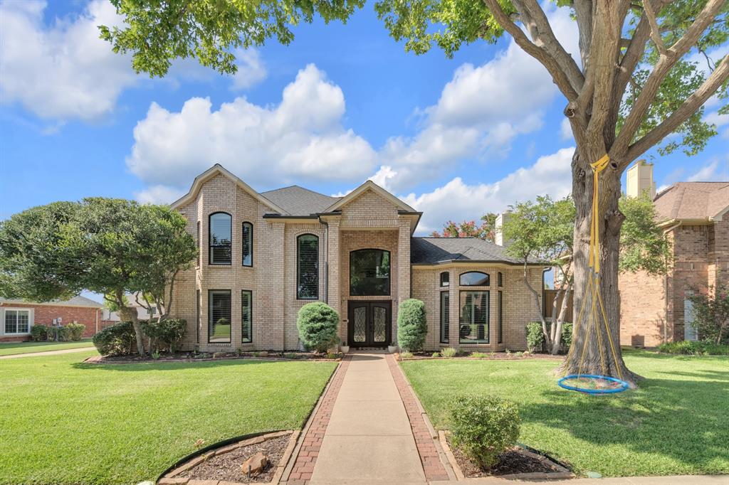 A rare blend of traditional elegance and contemporary design, this exceptional 3,524 sq. ft. two-story home in Plano ISD showcases a unique C-shaped architectural design centered around a private interior courtyard. With timeless curb appeal, striking black-framed windows, and an impressive black steel front door, this beautifully updated residence offers an extraordinary combination of style, functionality, and extensive upgrades. The thoughtfully designed floor plan creates seamless indoor-outdoor living with abundant natural light, courtyard views from multiple rooms, and a spacious backyard with mature landscaping ideal for entertaining and everyday enjoyment. Featuring 4 bedrooms, 3.5 baths, and a flexible bonus room currently used as a home office, this home offers exceptional versatility. One of the three garage bays has been converted to storage and can easily be converted back. The main level showcases high-end luxury vinyl plank flooring, two fireplaces, updated lighting, and a modern kitchen with quartz countertops, and a ZLINE 36-inch six-burner gas range. The primary suite features a beautifully renovated bath finished with Dolomite White marble. Upstairs offers new carpet, a remodeled ensuite bath, and an additional private ensuite bedroom. Extensive improvements include a 30-year roof with water membrane underlayment, a complete PEX-A plumbing upgrade (2024), new downstairs 5-ton two-stage HVAC (2023), replacement black-framed vinyl windows, upgraded irrigation system, courtyard drainage improvements with French drains and foundation drip system, gutter screens, wired CCTV system.  Additional enhancements include modern light fixtures, designer ceiling fans, and spray foam insulation in the primary suite. The signature C-shaped design fills the home with natural light while creating a private courtyard retreat rarely found in residential properties. Exemplary Plano ISD. NO HOA. Close to parks, shopping and easy commute. A MUST SEE!