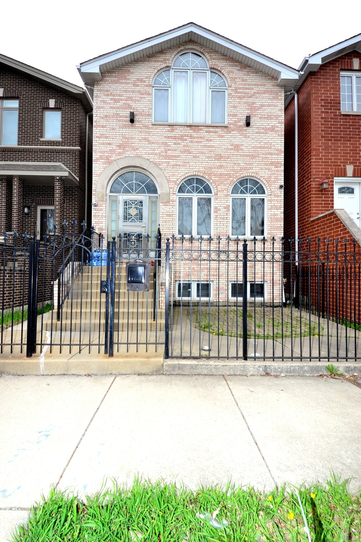Welcome to this stunning 5-bedroom, 3-bathroom brick home, located in the heart of Bridgeport. The main floor features soaring 10-foot ceilings and brand-new flooring throughout the living room and dining/kitchen area. The expansive living room is filled with abundant natural light from numerous windows, creating a warm and inviting atmosphere. The kitchen offers plentiful cabinet space and opens onto a large deck, perfect for enjoying a BBQ. Upstairs, the second floor boasts three spacious bedrooms, including a master suite with cathedral ceilings and a beautiful custom-made arched window. The lower level is ideal for an in-law arrangement or guest accommodations, featuring a large family room, a full bathroom, and two additional bedrooms. This home also includes an efficient dual-zone HVAC system for optimal comfort. Outside, you'll find a large fenced backyard, perfect for outdoor activities, and an extra-large 2.5-car garage. The location is incredibly convenient, within walking distance to Halsted and 35th Street bus stops, and just steps away from the storied Bridgeport Arts Center, Wilson Park, a variety of restaurants and shops, Chinatown, and Guaranteed Rate Field. Additionally, it's close to all major highways, making commuting a breeze. Don't miss the opportunity to own this beautiful home in a prime location!