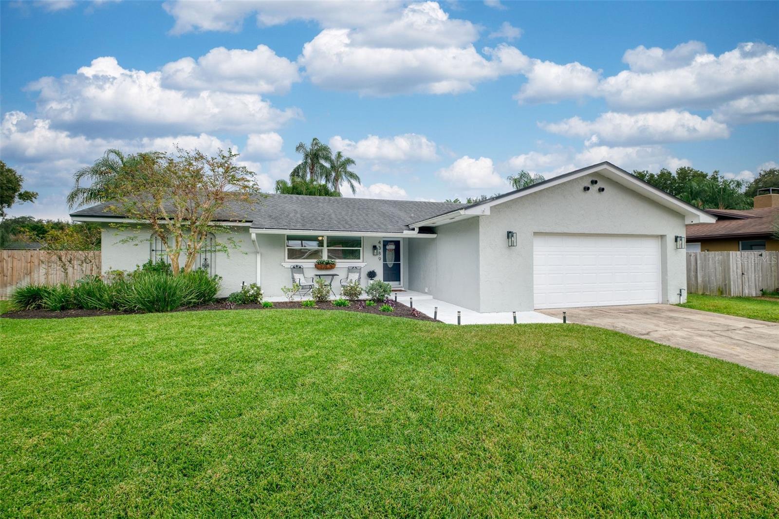 Under contract-accepting backup offers. Welcome to 4389 Carolwood Street! A beautifully updated pool home located in one of Conway’s most desired neighborhoods, Lake Conway Woods. This thoughtfully improved 3-bedroom, 2-bathroom residence blends modern upgrades, smart-home features, and exceptional outdoor living; creating a home that is as functional as it is inviting.Step inside to an open and airy layout highlighted by upgraded lighting, new bedroom flooring, and a fully renovated modern IKEA kitchen. Designed for convenience and style, the kitchen features roll-out drawers, a spacious pantry, stainless steel appliances, a farm sink, and generous seating at both the center island and the eat-in dining area. This is the perfect space for hosting guests or enjoying everyday meals.The primary suite offers comfort and privacy, complete with a renovated walk-in shower and tasteful updates throughout. Additional home enhancements include all-new domestic water piping, new attic insulation, electrical system upgrades, and newly installed epoxy flooring in the garage.Outdoor living is where this property truly shines. Enjoy a large sparkling pool, Bluetooth outdoor speakers, and smart exterior lighting (sconces + string lights) that transform the backyard into a relaxing, resort-style retreat; ideal for unwinding after a long day or entertaining friends and family.The community’s low annual HOA fee provides access to a private neighborhood area featuring a playground, picnic space, dock, and boat ramp with direct access to the Conway Chain of Lakes; one of Central Florida’s most beloved and sought-after waterways.Conveniently located near top-rated schools, and just minutes from Downtown Orlando, the Orlando International Airport, shopping, restaurants, and entertainment, this home offers the perfect balance of comfort, convenience, and community.Experience the best of Conway living! Schedule your private showing today.