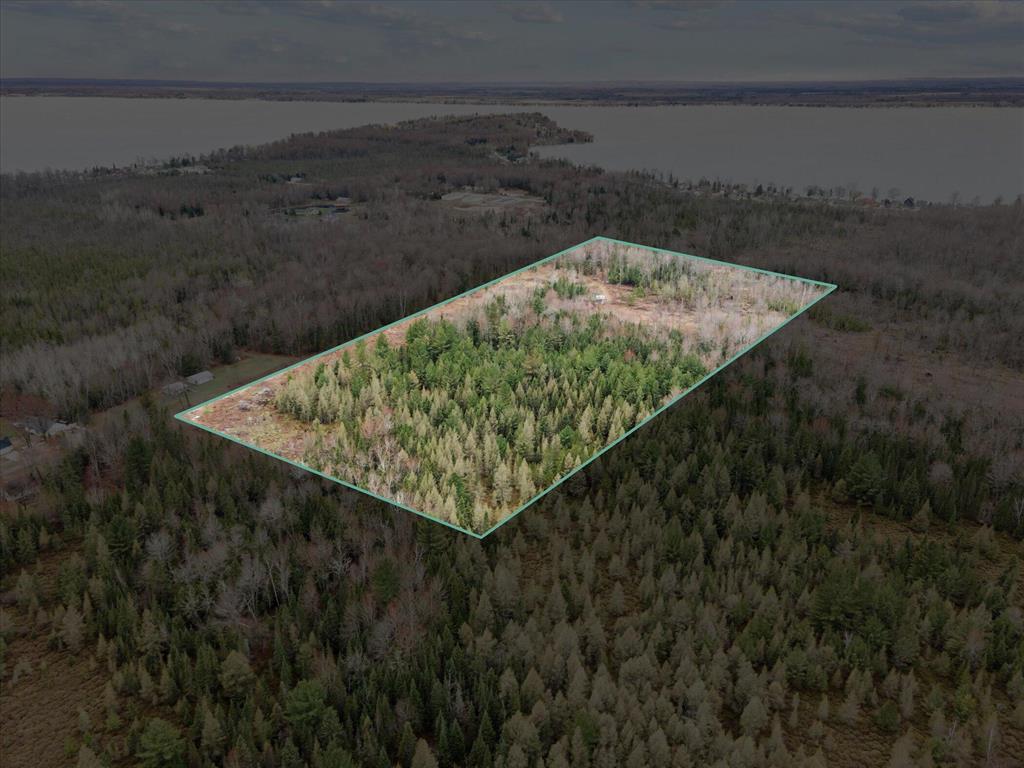 This secluded nearly 20 acre parcel is populated with mature cedar trees and offers excellent potential for hunting, camping, or building a peaceful up-north retreat. The property borders state land, providing direct access to many acres for outdoor recreation. Less than one mile from Houghton Lake, Michigan's largest inland lake, this location is perfect for nature lovers, sportsmen, or anyone seeking privacy and proximity to water and wildlife. A rare opportunity to own a beautiful piece of land in a highly desirable area! As an added bonus this property has also been recently surveyed saving you time and money! This one will NOT last!