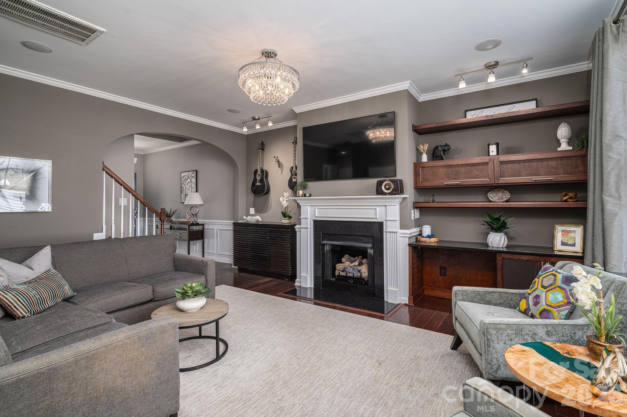 You’ve worked hard, executed your strategy, and earned a lifestyle that refuses to compromise on quality. Welcome to 233 Park View Dr—a townhome redefined for the modern high-achiever! This stone-accented masterpiece trades traditional aesthetic for sharp, contemporary sophistication. The chef’s kitchen is a triumph of design, boasting premium granite counters, a top-tier gas range, and elite appliances that cater to your refined taste. Tailored perfectly for the work-from-home professionals who value flawless connectivity and a rapid route to the interstate, this home is your personal executive suite. Ascend to the upper level to find a spacious, open loft area—the perfect versatile space for a wellness studio with room for your infrared sauna, a media lounge, or private retreat. Every detail is calculated for peak organization, from the upgraded solid closet shelving to a pristine double garage featuring sleek storage cabinetry and polished epoxy floors. When it’s time to clock out, step onto the private rear deck to enjoy a drink by the stone ledge featuring your own cozy chiminea. Beyond what meets the eye, this residence offers exclusive, hidden luxuries tailored for a one-of-a-kind lifestyle. The main level boasts an extensive speaker system expertly wired to a central living room cabinet, ensuring seamless audio entertainment without the visual clutter. The professionally designed interior highlights breathtaking light fixtures. Upstairs, the primary suite conceals its finest secrets: the primary bath features a built-in wall safe easily hidden behind your choice of artwork, while the bedroom ceiling holds a stunning, custom constellation installation that magically comes to life under a blacklight. The primary bathroom mirror transforms into a TV once connected to streaming services. Located in the exclusive Waters Edge community, with a short walk to the YMCA, and zoned for Belmont schools, step into the elevated standard of living you deserve!