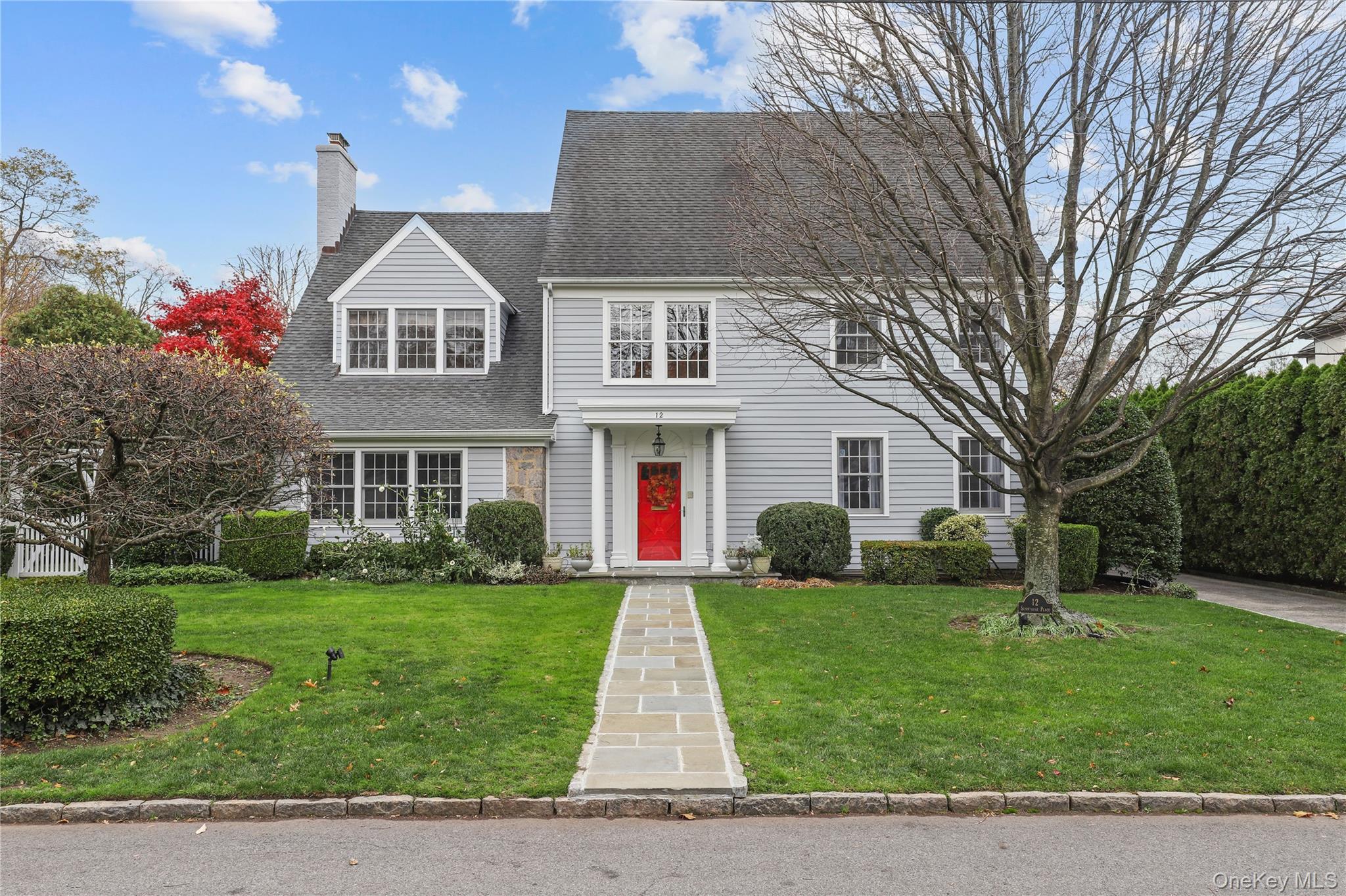 Beautifully maintained Colonial in one of Bronxville’s most sought-after neighborhoods. This charming home offers a generous and thoughtfully designed floor plan ideal for today’s lifestyle. The welcoming formal entry opens to a light-filled family room with views of the backyard. The formal living room features a gas fireplace, French doors to the patio, and an adjoining sunroom—perfect as a home office or spacious sitting room. A formal dining room and large family room with surround sound and French doors overlooking the backyard provide seamless spaces for both relaxation and entertaining. The eat-in chef’s kitchen is equipped with stainless steel appliances, a center island, and abundant cabinetry. Upstairs, the expansive primary suite includes a luxurious bath with soaking tub and a large walk-in closet. Three additional bedrooms and a renovated full hall bath complete the second floor. The third level offers another bedroom plus two flexible rooms—each perfect for a second home office, playroom, or guest suite—along with generous storage. The finished lower level with an additional 1,297 sq ft, features a gas fireplace, recreation room, 200+ bottle cedar wine closet with WhisperKOOL 1600 system, gym area, laundry room, and mechanicals. Outside, the backyard provides a flat, private landscape with a generous patio ideal for dining, relaxing, and play. Just a short stroll to Bronxville Village shops, restaurants, and train, this home perfectly blends comfort, convenience, and timeless charm.
