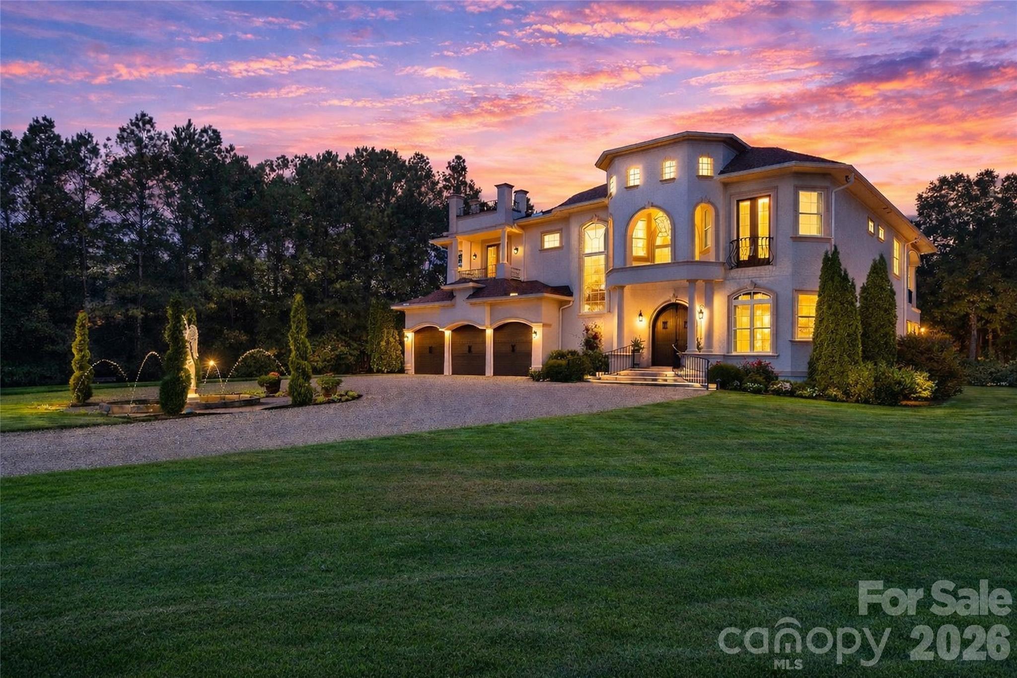 Set on more than 36 acres of rolling countryside, Belle Tesoro offers a rare opportunity to own a private estate designed for those who value space, seclusion, and control over their surroundings. Positioned just outside Spartanburg, the property delivers a level of privacy and scale that is increasingly difficult to find—where the approach itself, a gated and tree-lined drive leading to a circular motor court and fountain, immediately establishes a sense of arrival that is both refined and removed.The estate encompasses over 5,100 square feet of thoughtfully designed living space, where soaring ceilings, natural light, and custom millwork create an atmosphere of quiet sophistication. A dramatic sweeping staircase anchors the main level, complemented by a layout that balances everyday functionality with the ability to host and entertain with ease. The chef’s kitchen, formal dining room, and library provide structure and purpose to the home, while multiple fireplaces introduce warmth and character throughout. The primary suite serves as a true private retreat, featuring a spa-style bath, private balcony, and elevated views across the surrounding landscape.Outdoor living is equally intentional. Covered verandas and expansive patios extend the home into a resort-style setting, centered around a pool and fountain framed by manicured grounds and mature landscaping. Beyond the immediate homesite, the acreage opens into a blend of cleared pasture and wooded privacy, offering flexibility for a range of lifestyle uses—from recreational enjoyment to agricultural pursuits (see tax records for land designation).For buyers seeking a property that prioritizes privacy over proximity and land over density, Belle Tesoro represents a compelling alternative to traditional luxury offerings. It is a residence defined not only by its architecture, but by the freedom and space it provides—an estate environment designed for long-term living, personal vision, and a level of separation that cannot be replicated in more conventional settings.