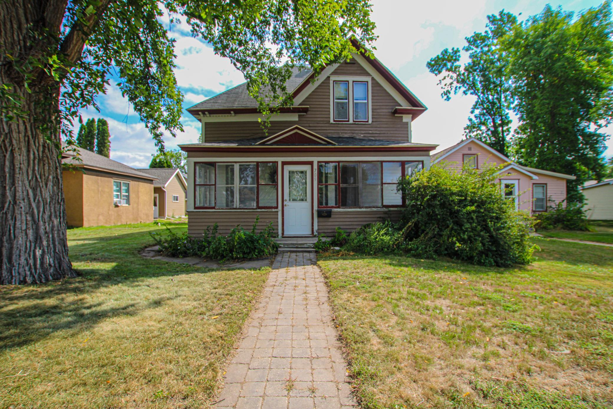 Step inside and discover the character and craftsmanship of a classic Sauk Centre home! This 3-bedroom, 2-bath property showcases beautiful early 1900s details, including original mouldings, hardwood floors, an impressive staircase and timeless woodwork that gives the interior a warmth you simply don't find in newer homes. A separate walk-in closet/dressing room adds unique space and functionality, while the formal dining room and large kitchen provide plenty of room for everyday living and entertaining.Front and rear porches add to the traditional character of the home, and a detached garage provides additional storage and parking. While there are exterior improvements and updates to consider, the interior offers a wonderful foundation for someone who appreciates historic charm and sees the potential to make this property their own.Located in Sauk Centre, Minnesota, this home is an opportunity to bring new life to a property filled with original character, hardwood floors, beautiful architectural details and the craftsmanship of another era. If you've been searching for a home with personality, space and restoration potential rather than something cookie-cutter, this one deserves a closer look.