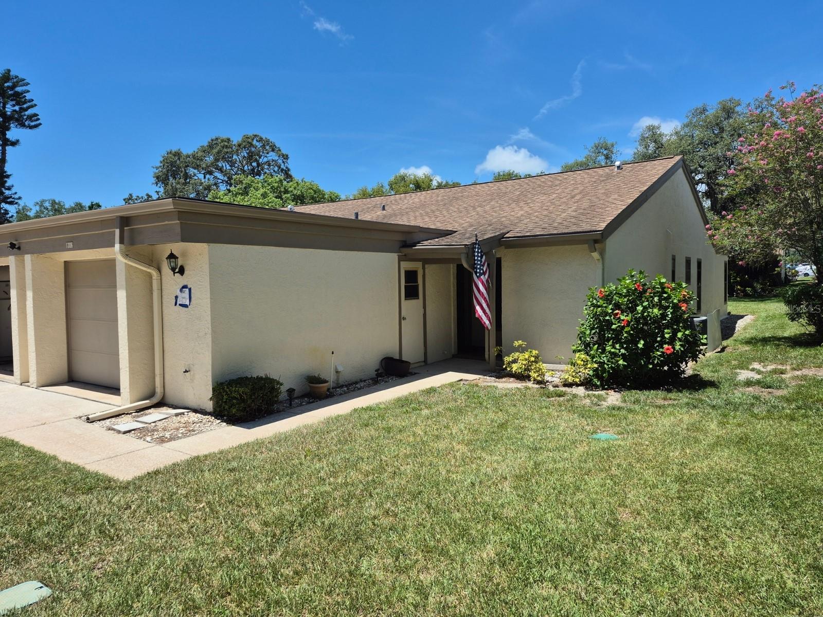 Just south of Tarpon Springs, right in the center of everything there is to do on the Central West Coast of Florida sits Green Dolphin Park Villas, a quiet, friendly, 55 plus community where you can count on everything outside the door of your condominium villa to be taken care of for you while you enjoy friends, visitors, the pool, tennis, clubhouse and activities. There's also lots of local beaches, multiple parks, downtown Tarpon Springs with the Sponge Docks, Clearwater and Clearwater Beach, Tampa, Saint Pete, the Gulf of America and Tampa Bay and all of Central Florida! The convenience of this community's location is absolutely perfect. Come see this end unit (that means more windows!) with a spacious master suite, great room combining dining and living room, eat in kitchen, an enclosed Florida room, guest bath and bedroom and attached garage with an entrance into the kitchen.  Right outside the back door is a beautiful oak tree and just to the side is one of the community swimming pools. Everything about this home says, "Relax..."  Carpeting, TLC and some updating are needed and the price is adjusted accordingly but that is what makes this home special to the one who is ready to make it their own. Connect, bring an offer and let's make a date for you to see this home before it's gone!