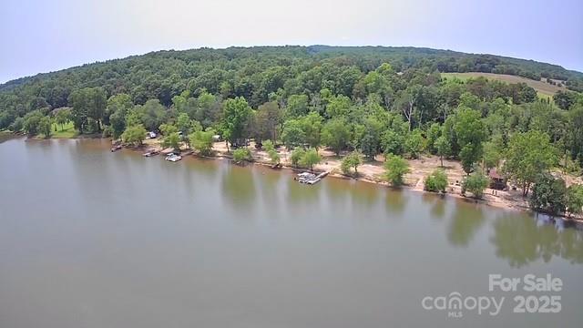 Lake life, camping, boating, sunrises & sunsets, fishing, watch eagles soar.  Does that sound like your best life? Lake Lookout Campground is your ticket. Campground has 19 RV/tent spots w/ electricity and water, and 8 boat slips along aprox 950 lineal feet of water frontage.  There is a bathhouse with 4 showers, 4 sinks, and 4 toilets. There is snack shop.  Above bathhouse and snack shop is a cabin used as an Airbnb.  Campground has 1 boat, 6 kayaks, and 4 paddleboards for rent. There are 3 septic tanks, (that includes dump station) I dont have size of septic. County has 1 septic on record, 2 are not. There is 1 well with new supply and pump. 8 piers on survey, currently 4 that have been rebuilt, upgrading the hardware, gangways and platforms. Entry Road graded and has new gravel coming. Cabin has new countertop, cabinetry, sink, 3 new windows, mirror, and finish work.
Address can come up as 3764 or 3766 Highwater Rd.
Campground is open for business, please respect campers privacy.