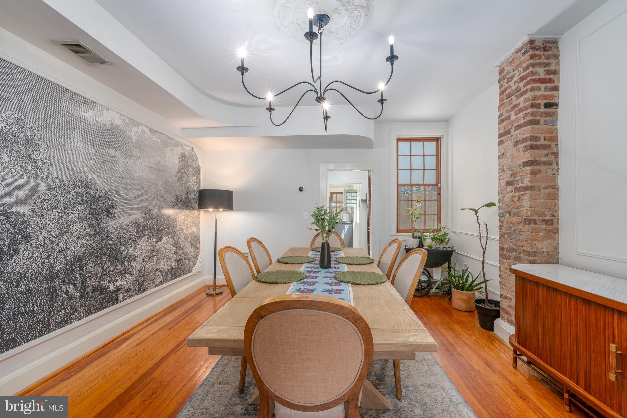 521 South Ann Street delivers the character buyers want in Fells Point with the thoughtful updates that make a historic home genuinely easy to live in.Inside, original architectural details are paired with a more polished, design-forward feel. Warm wood floors, exposed brick, designer lighting, fresh paint, custom built-ins, and a striking fireplace create inviting living and dining spaces that feel collected rather than overly renovated. The updated kitchen offers plenty of storage and workspace while maintaining the personality of the home.Upstairs, generous bedrooms provide flexibility for everyday living, guests, or working from home. The renovated bath features elevated finishes, and second-floor laundry is a major practical upgrade rarely found in a classic row home in this price range. The third floor offers even more room to spread out, whether used as a bedroom retreat, office, lounge, studio, or combination of spaces.Out back, the private brick courtyard creates a true extension of the living space—perfect for dinner outside, morning coffee, gardening, or entertaining friends.And then there is the location. Set in the heart of Fells Point, 521 S Ann puts the waterfront, neighborhood cafés, restaurants, shops, fitness studios, Greedy Reads, the Saturday Farmers Market, and longtime favorites like Peter’s Inn just outside your door. Grab coffee at Pitango or The Daily Grind, walk to the harbor, and leave the car parked with Area 16 permitted parking available.Historic character, updated interiors, flexible living space, private outdoor space, and one of Baltimore’s most walkable locations—521 South Ann Street offers the kind of Fells Point lifestyle that is increasingly hard to find.