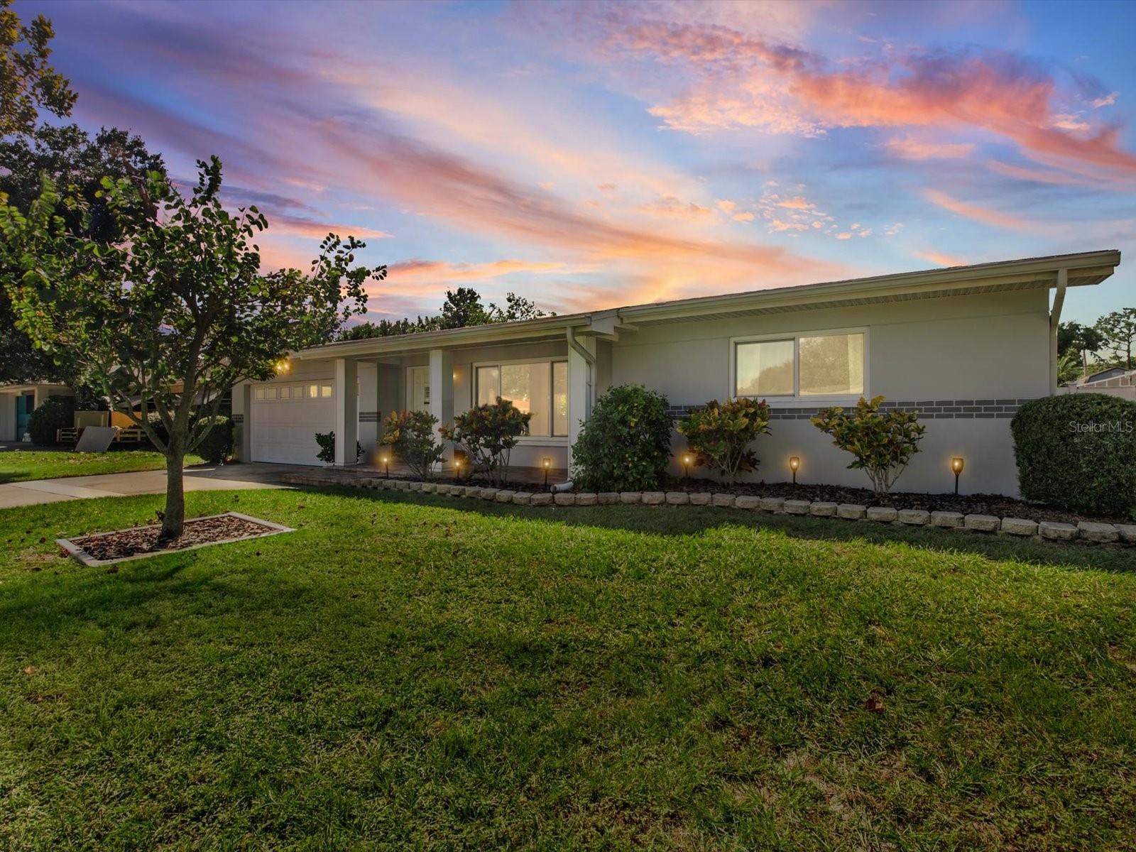 YOUR GOING TO FALL IN LOVE WITH THIS ONE! BEAUTIFUL curb appeal, EXCEPTIONAL updates, and a backyard made for enjoying the Florida lifestyle! This METICULOUSLY maintained Clearwater home sits on a generous .22-acre lot and offers a fresh, modern feel throughout. An inviting paver front porch welcomes you inside, where you'll find smooth ceilings, newer interior doors, abundant natural light, and NO CARPET!The spacious family room features a beautiful bay window, while the light-filled dining room opens through French doors to the outdoor living space. The kitchen offers stainless steel appliances, a GAS RANGE for those who love to cook, and a pantry closet. All bedrooms are GENEROUSLY sized, including a secondary bedroom large enough for a king-size bed. The oversized primary suite features a STUNNING, extensively RENOVATED en-suite bathroom with QUARTZ countertops, a taller vanity, gorgeous walk-in shower, and stylish barn door. The second bathroom has also been updated with a granite-topped vanity. This home has SMOOTH CEILINGS throughout! Step outside to an EXPANSIVE backyard featuring a SCREENED-IN sunroom, OVERSIZED paver patio, storage SHED, and PLENTY OF ROOM FOR A FUTURE POOL! Whether entertaining friends or enjoying a quiet evening outdoors, this space offers endless possibilities.MAJOR IMPROVEMENTS ALREADY COMPLETED! Whole-house repiping (2025), roof (2020), hurricane-rated windows THROUGHOUT (2020), A/C (2017), and additional attic insulation with two thermostatically controlled fans (2022). A gas water heater adds to the home's appeal.Ideally located near Clearwater Beach, Sand Key Park, Largo Central Park, Eagle Lake Park, and the Pinellas Trail, with convenient access to shopping, dining, airports, and everything Tampa Bay has to offer.Immaculate, move-in ready, and beautifully cared for, this home delivers the updates buyers want and the outdoor space that's hard to find. Don't forget to check out the Social Media Reel! PRICE TO SELL!