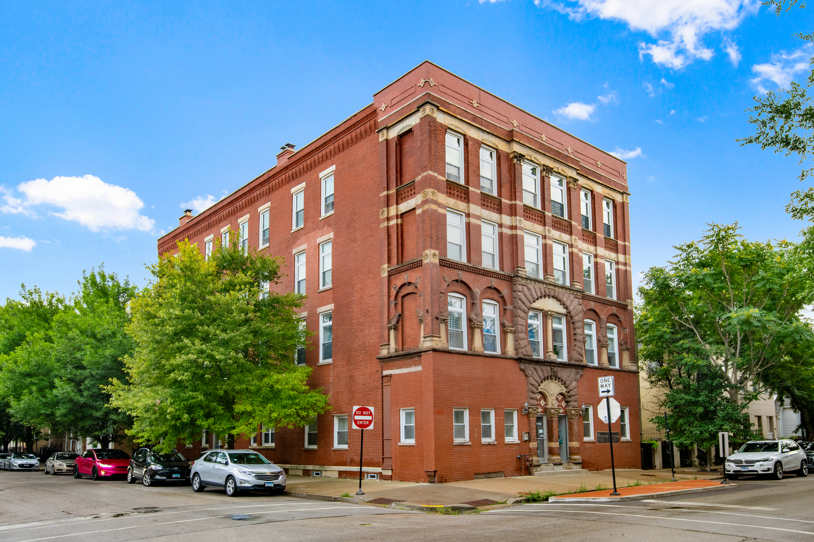 One-of-a-Kind Renovated 2BR/2BA Duplex-Up Penthouse in the Heart of Wicker Park!  Welcome to this truly unique and stylishly updated penthouse, offering the perfect blend of modern luxury and vintage charm in one of Chicago's most vibrant neighborhoods. This bright and airy east-facing home is drenched in natural light thanks to oversized windows and soaring ceilings.  The open-concept main level features a sleek chef's kitchen with quartz countertops, a spacious island, rich cabinetry, and high-end stainless steel appliances - including a brand-new refrigerator and dishwasher installed within the past 12 months. The layout flows seamlessly into a generous living room with a decorative fireplace and ample space for a formal dining area.  Step outside to your private outdoor sanctuary - a spacious deck just off the living area that's perfect for any mood or moment. Sip your morning coffee while soaking up the sun, grab your laptop and turn it into your open-air home office, or host intimate dinner parties under the stars. This is outdoor living at its best.  Upstairs, you'll find two large bedrooms, including a stunning primary suite with a second private outdoor space offering breathtaking panoramic skyline views - the ultimate city backdrop.  The spa-inspired primary bathroom features a double vanity and a luxurious soaking tub, while the main-level bath impresses with bold designer tile and a walk-in shower.  Additional features include gorgeous hardwood floors, detailed millwork, exposed brick, central AC, a tankless water heater, second-floor in-unit laundry, and generous storage throughout. Extra storage and a bike room are also included.  All of this just steps from the Blue Line, Milwaukee/Division/Damen hotspots, boutique shopping, cafes, restaurants, the 606 Trail, grocery stores, and highway access.