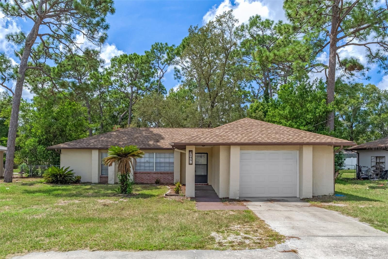3-Bedroom, 2-Bathroom 1 Car Garage Home On Over 1/3 Acre Offering A Spacious Floor Plan With Plenty Of Room To Relax And Entertain. The Home Features A Large Living Room And Separate Family Room, Providing Plenty Of Versatile Living Space. The Kitchen Is Equipped With Stainless Steel Appliances, Granite Countertops, And A Convenient Breakfast Bar, With A Breakfast Nook Just Off The Kitchen For Casual Dining. Luxury Vinyl Flooring Flows Throughout The Home, Creating A Clean, Modern Look With Easy Maintenance. Step Outside To The Screened-In Porch, An Ideal Spot For Enjoying Your Morning Coffee Or Unwinding In The Evening. The Large Fenced Backyard Offers Plenty Of Room For Outdoor Activities, Pets, Gardening, NO HOA. This Home Offers Comfort, Style, And Plenty Of Space For Everyday Living And Entertaining! 2016 Roof, 2022 A/C, 2016 Drainfield