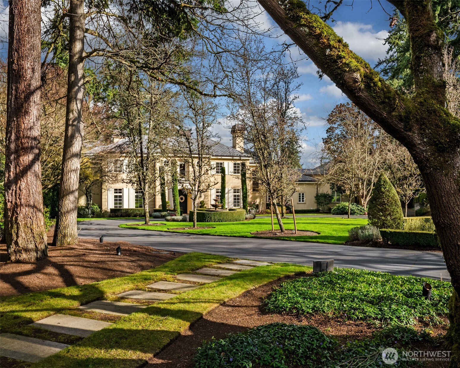 A gracious arrival through beautifully maintained grounds.