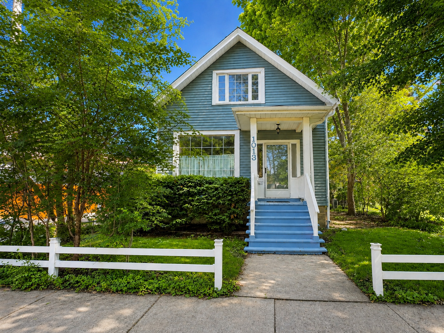 Historic charm meets smart, thoughtful updates in this light-filled home east of Ridge, directly across from Firefighter's Park. Enjoy exceptional walkability to the CTA, Metra, Northwestern University, downtown Evanston, and the lakefront. Major improvements include a new roof and main drain pipe in 2020, chimney work in 2023, dishwasher and luxury range with convection, air-fry, and sous-vide functions in 2024, refrigerator in 2025, and a central heat-pump system with air conditioning in 2026. Additional features include updated electrical systems, newer lighting, and home-automation and network wiring. Soaring 10-foot ceilings, hardwood floors throughout, original moldings, and lovingly preserved natural wood trim showcase the home's architectural character. The main level offers spacious living and dining rooms, two flexible bedrooms, and a full bath. Upstairs, refinished hardwood floors and skylights brighten the expansive primary suite, beautifully updated slate bath with RH fixtures, large tandem room, and flexible den-ideal for an office, nursery, dressing room, or creative space. A screened porch overlooks the quiet, private backyard, creating a peaceful retreat in the heart of the city. The basement with exterior access provides laundry, workshop, and substantial storage space. A rare opportunity to enjoy authentic architectural character, modern comfort, and exceptional walkability in one of Evanston's most desirable locations.