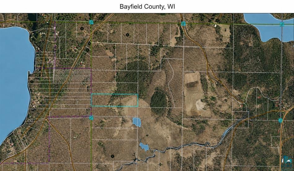 A fantastic hunting, recreational, or future homesite opportunity tucked away near Iron River. This secluded (9.43-acre) parcel is located at the end of Polkoski Way. Exceptional privacy with a beautiful mix of mature Oak, Maple, Birch, Balsam, White pine, and Norway pine throughout the property. There is plenty of level land suitable for a home or cabin site, making this an ideal setting for your Northwoods retreat. Pink survey flags mark the approximate property lines for easy identification.  Several acres of high ground offer an ideal building site, allowing you to clear space while maintaining privacy and the land's natural beauty. Bayfield Electric service and Norvado for high-speed fiber-optic internet are available at the road. The sandy soil conditions are favorable for a conventional septic system. Buyers are encouraged to confirm building setbacks and zoning requirements with Bayfield County. Outdoor enthusiasts will appreciate the incredible wildlife habitat surrounding the property. The Seller established several nearby food plots last year featuring clover, turnips, and rape, helping attract abundant wildlife, including trophy whitetail deer, turkey, grouse, ducks, and more. This area is known for some of the best waterfowl hunting in Northern Wisconsin, with opportunities to hunt directly from your own land. Within walking distance, enjoy access to the Class A Iron River, renowned for Brook and Brown Trout fishing, as well as excellent canoeing and kayaking for those looking to explore the peaceful beauty of the river. The location is ideal for year-round recreation, just minutes from thousands of acres of public land and miles of maintained ATV and snowmobile trails. Leave directly from your driveway—no need to trailer your toys.
