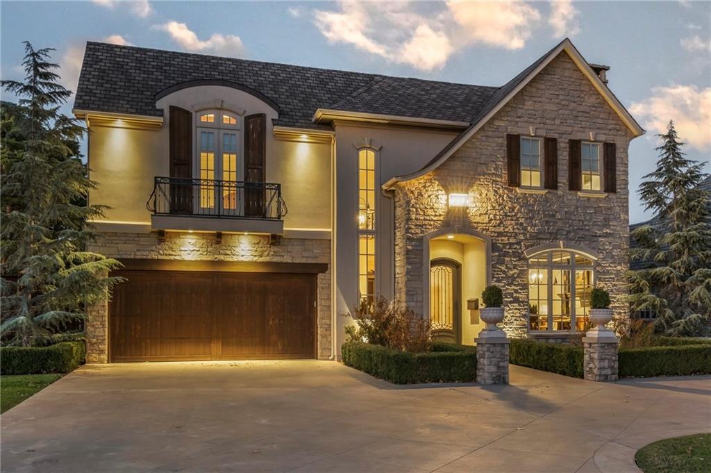 Beautifully designed custom home built in 2014, offering 4 bedrooms, a dedicated study, game room and desirable downstairs Primary Suite.  Thoughtfully crafted with handscraped wood floors, distinctive ceiling details, designer lighting, and elegant wrought iron accents throughout.  The light filled study features a striking marble fireplace, while the spacious open-concept kitchen is equipped for both everyday living and entertaining, complete with a butler's pantry and prep sink.  The inviting living room overlooks the resort style backyard with pool, spa, water features and manicured landscaping.  The private primary suite offers tranquil backyard views, luxurious bath and an oversized closet.  Upstairs a spacious game room with wood beams and custom built ins provides additional living space.  Exceptional indoor-outdoor living in one of the areas most sought-after locations.