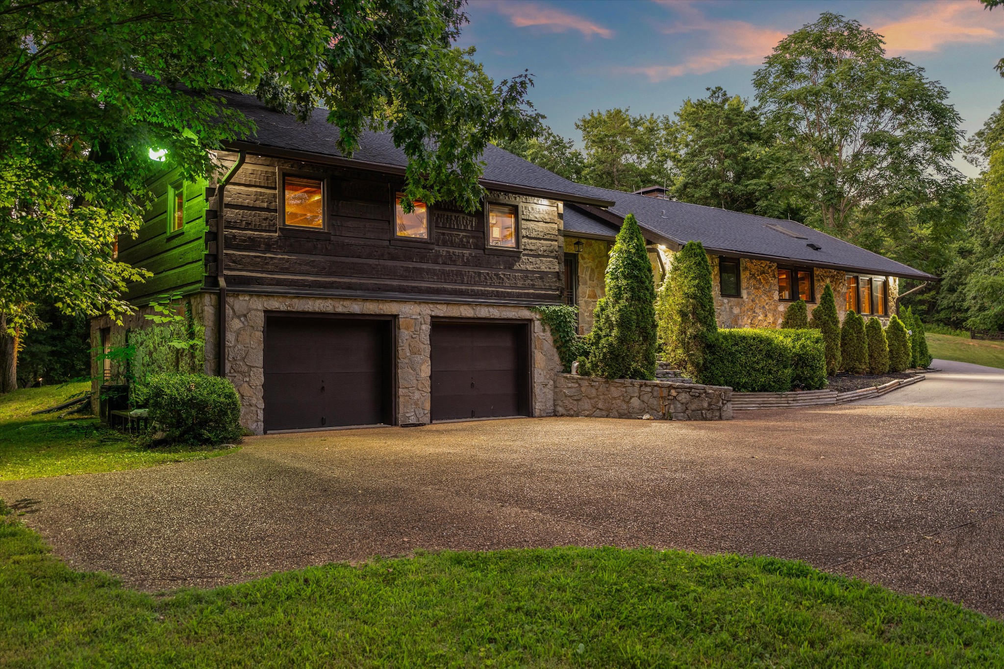 Just minutes from Leipers Fork Village, this extraordinary 41.5-acre gated estate redefines sophisticated country living. Hidden behind a winding half-mile paved drive, it feels worlds away yet is perfectly connected to the heart of Leipers Fork. The estate features a masterfully renovated, hand-hewn log and stone home—a blend of artistic design and modern comfort—featuring two stone fireplaces, a chef's kitchen, and a private primary suite. A large bonus room, currently a studio, could make an ideal 4th bedroom. Adjacent to the home, an enclosed, climate-controlled sun porch provides seamless access to the private outdoor wellness retreat complete with a hot tub, sauna, and cold plunge overlooking the trees.

The estate is an unrivaled compound for entertaining, anchored by a fully renovated, climate-controlled barn (currently a gym/guest space). Separately, at the crest of the land, a spectacular ridgetop swimming pool in its own private area offers scenic views and features a custom container bar perfect for epic gatherings. The over 41 acres offer rolling pasture, two stocked ponds, and mature woods. With two approved perc sites, including one adjacent to the pool (approved for 5-6 bedrooms), the opportunity for expansion is exceptional. This is one of the most captivating and thoughtfully designed country sanctuaries in Leipers Fork.