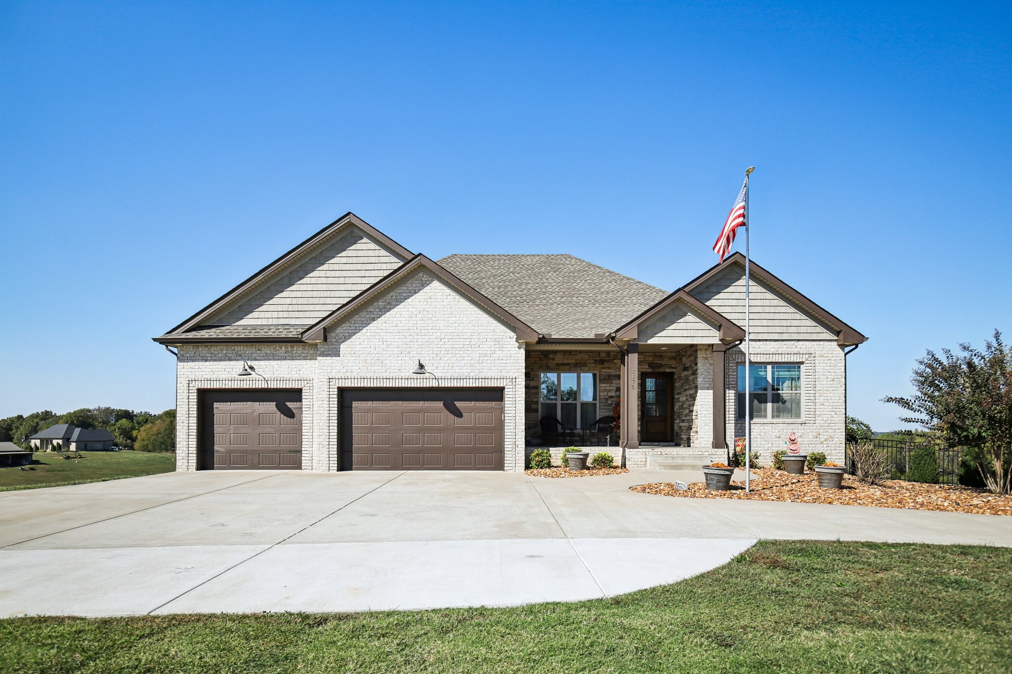 Welcome to this stunning 4-bedroom, 3-bathroom home, offering 3,964 square feet of living space on a beautiful 5.01-acre property. The main level features spacious living areas and a thoughtfully designed kitchen, perfect for both everyday living and entertaining. The full finished basement includes a second kitchen, a storm shelter, and plenty of space for guests or recreation. Step outside to a screened-in porch overlooking the heated, inground saltwater pool—a 32x16 oasis built in May 2024 by Calhoun Pools of Hopkinsville. The pool features a 5½-foot deep end, a waterproof winter cover with a pump to shed rainwater, and a robot cleaner that will convey. Enjoy the expansive backyard, ideal for relaxing or entertaining. The property also includes a 3-car attached garage and a 32x40 detached garage/shop with a 10x40 covered porch—perfect for extra storage, hobbies, or workspace. Combining privacy, space, and resort-style amenities, this home offers the perfect blend of comfort and functionality.