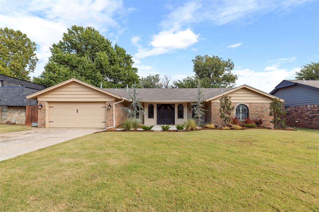 This beautiful home instantly draws you in with its grand double front doors, classic brick exterior, and manicured front yard. Step inside and you’ll be welcomed by a bright, open-concept layout that makes the whole home feel warm and spacious. The living areas flow seamlessly together, with arched doorways and stunning arched windows that give the space so much charm and character. A cozy fireplace anchors the living room, while the open dining and kitchen areas make it easy to gather and entertain. The kitchen is modern and stylish, with sleek counters, updated cabinetry, farmhouse sink, and plenty of room for prep and storage — perfect for everyday living or hosting guests. You’ll find spacious bedrooms with great natural light, ceiling fans, and fresh finishes throughout. All bathrooms are spacious with neutral tones that make them feel fresh and timeless. The backyard is made for enjoying Oklahoma evenings — with a huge covered patio, plenty of shade from mature trees, and a fenced yard that’s perfect for BBQs, playtime, or just relaxing. This home blends charm and modern updates beautifully — the perfect place to settle in and make your own.