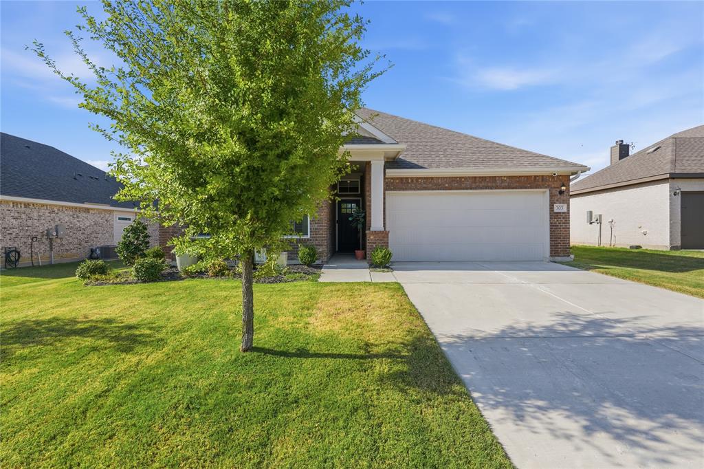 Welcome to 303 Ranch Rd, a beautifully updated 4-bedroom, 3-bath home in Justin’s desirable Reatta Ridge community. The open-concept layout offers a spacious, inviting feel with stylish updates throughout, vinyl flooring in the main living areas, and an electric fireplace anchoring the living room. Step outside to a covered patio perfect for relaxing or entertaining. Located in highly sought-after Northwest ISD with low city tax rates, NO MUD and NO PID. Move-in ready and situated in one of DFW’s growing communities—come see what makes this home special!