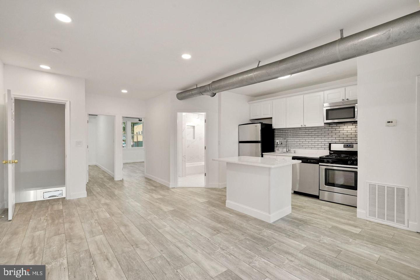 Amazing rental in the heart of Brightwood Park! Fully renovated, Contemporary, bright, and sleek, describes this large, 2b/2b condo, in the growing Georgia Avenue Corridor. Huge Living Room with a deluxe kitchen with Island. The following are some of the highlights of the subject property: Huge living room, dining room, kitchen combo, deluxe custom kitchen with gas stove, washer/dryer combo, stainless steel appliances, custom bathrooms, Walk in closet, Central AC and No Condo Fee! Short distance to Rock Creek Park, restaurants, multiple Metro and bus stops. Both the Petworth and Columbia Heights neighborhoods are within walking distance.Tenant will be responsible for a monthly utility payment of $250.