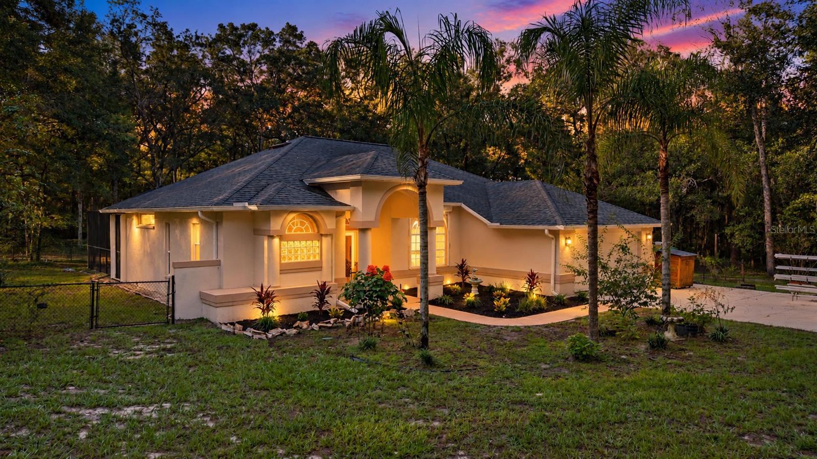 Located in Brooksville on FIVE ACRES in Florida’s Nature Coast, this 3-bedroom, 2-bathroom POOL HOME offers the best of peaceful living with no HOA, no flood zone, and agricultural zoning making this property an incredible opportunity for those who want room to breathe, space for their animals, and a lifestyle surrounded by nature!!From the gated entrance, a private driveway welcomes you with mature palm trees, established landscaping, and the charm of a peaceful country setting. Inside, you’ll find tall ceilings, wood-look tile flooring throughout the living areas, tile flooring in the kitchen, and absolutely NO carpet. Three spacious bedrooms, an indoor laundry/mud room, and a large two-car garage provide comfort and functionality for everyday living.Step outside and discover your own private escape. Cool off in the screened-in pool equipped with a Pentair pump and heater, while relaxing beneath the shade of tall, mature trees, The acreage offers room to roam, garden, bring your animals, and enjoy the freedom and serenity that comes with country living!RV AND BOAT OWNERS — THIS PROPERTY IS READY FOR YOU! Enjoy THREE RV hookups, including two 30-amp connections and one 50-amp outlet, plus an RV driveway and huge carport to store your boat, additional vehicles, or additional storage. Whether you own an RV, boat, need additional parking, or want extra flexibility for your property, these features are a major bonus!Peace of mind comes with a 2020 roof and PREMIUM hurricane shutters representing an upgrade valued at over $20,000. And one of the most exciting features? An ASSUMABLE VA loan with a 3.25% INTEREST RATE!! For a qualified buyer, this is an exceptional opportunity to secure financing at a rate well below many current market offerings.And then there’s the wildlife — because this is the Nature Coast! Enjoy the beauty of Florida’s natural surroundings, with wildlife sightings that may include fox squirrels, flying squirrels, wild turkeys, sandhill cranes, hawks, owls, woodpeckers, and even the occasional black bear or swallow-tailed kite. From birds visiting the fence near the pool to wildlife moving through the trees, nature becomes part of your everyday experience.Five acres. Three HUGE bedrooms. Two bathrooms. A screened pool. RV accommodations. Agricultural zoning. No HOA. No flood zone. And a potential 3.25% assumable VA loan. If you’ve been searching for privacy, freedom, and a slower pace of life without feeling disconnected from Tampa, this Brooksville property deserves your attention. Come experience the space, the serenity, and the possibilities of owning your own piece of the Nature Coast.