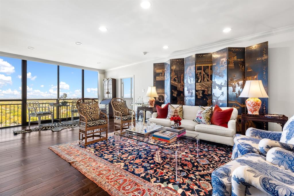 Gorgeous, hard-to-find 20th-floor turnkey condo at the coveted Athena High Rise, offering an extraordinary combination of luxury, style, and breathtaking panoramic views. This 2-bedroom, 2-bathroom lock-and-leave residence boasts unobstructed north-facing vistas through expansive floor-to-ceiling windows, flooding the home with abundant natural light.Meticulously updated and move-in ready, the condo features rich hardwood floors and freshly painted interiors in the designer-favorite White Dove. Both bathrooms are adorned with sophisticated Thibaut wallpaper, adding a touch of timeless elegance. The modern kitchen is equipped with premium Bosch appliances, including an induction cooktop, perfectly blending style and functionality for everyday living and entertaining.Open-concept living and dining spaces create a seamless flow, ideal for hosting gatherings or relaxing in comfort. Both the primary and guest bedrooms are generously proportioned with abundant storage, while the oversized primary suite features custom built-ins for added sophistication and organization. Additional amenities include a private storage room and assigned parking for up to one vehicle per resident.Nestled in an exceptional Preston Hollow location, yet directly across the street from The Park Cities, this condo offers the perfect balance of upscale neighborhood charm and city convenience. Residents enjoy 24-7 concierge services and building security, an indoor salt water pool, while the HOA covers all utilities, delivering a true lock-and-leave lifestyle in one of Dallas’ most desirable high-rise communities. Listing agent is related to seller and both are licensed TX realtors.