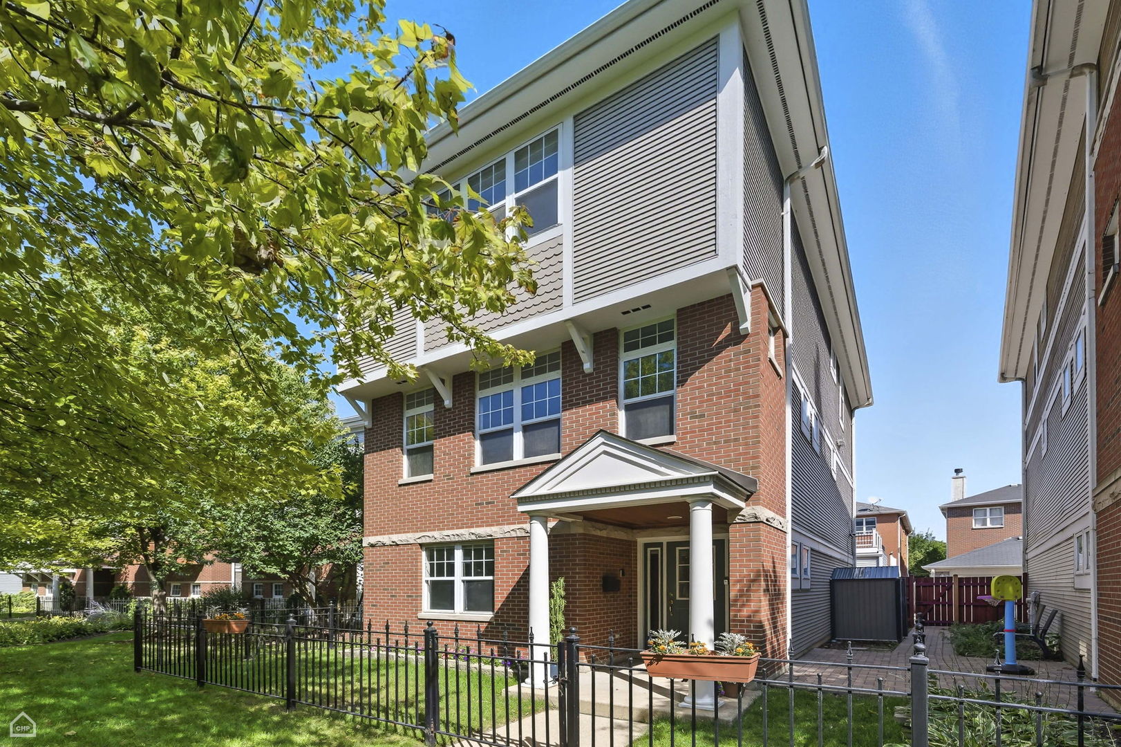 Rarely available single family detached home in the highly desirable private Cornell Square development. This bright and sunny home is truly in move-in condition, freshly painted throughout in neutral tones, with newly stained hardwood floors on the main level and brand-new carpeting in bedrooms. This spacious 4 bedroom, 3.5 bath modern home includes a large eat-in kitchen with a balcony for outdoor grilling and an entire wall of deep pantry storage. The ground level has a 4th bedroom with a private full bath, perfect for a guest room, in-law suite, office or den. The top floor features a primary suite with two walk-in closets, an en-suite bath with double sink vanity and a separate shower and tub, as well as two additional large bedrooms and a hall bath. A full-sized washer and dryer are also conveniently located on this level. Other amenities include custom closets throughout, a wood-burning fireplace in the spacious living room, surround sound and intercom. A real plus is the attached 2-car garage. The many improvements of this modern home include a new tear-off roof in 2022, a new furnace in 2020, new A/C in 2016, new hot water tank in 2017, and exterior wood painted in 2022.  Minutes from Lake Michigan, the University of Chicago and Lab School campuses, Lake Shore Drive access, and downtown transportation.